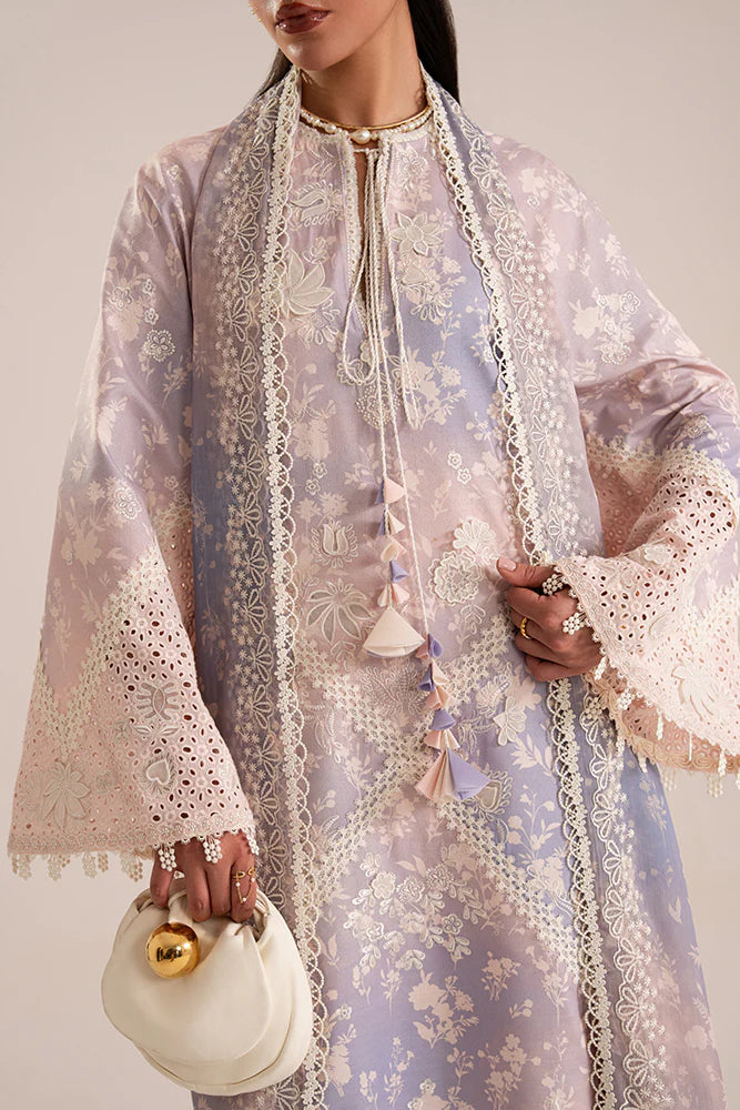 Model wearing Eeshar by Suffuse in pastel lilac and blue with delicate embroidery – elegant Pakistani luxury pret outfit in UK.