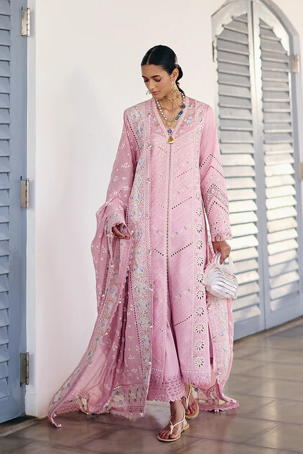Model wearing pastel pink embroidered dress with intricate lace details from Suffuse Casual Pret 2025 Safar. Pakistani luxury pret in UK