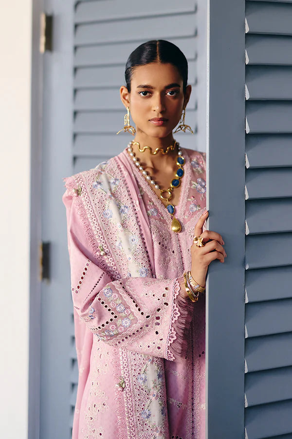 Model wearing pastel pink embroidered dress with intricate lace details from Suffuse Casual Pret 2025 Safar. Pakistani luxury pret in UK