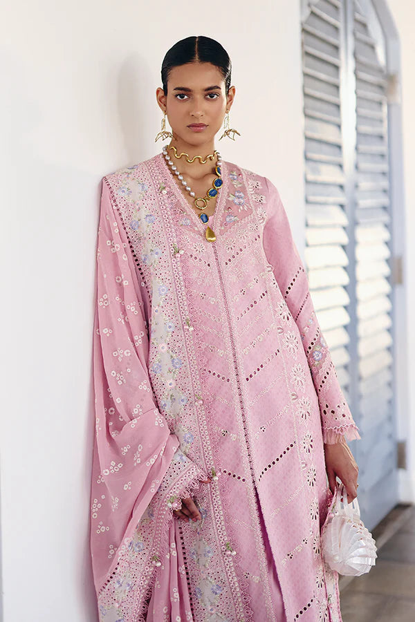 Model wearing pastel pink embroidered dress with intricate lace details from Suffuse Casual Pret 2025 Safar. Pakistani luxury pret in UK