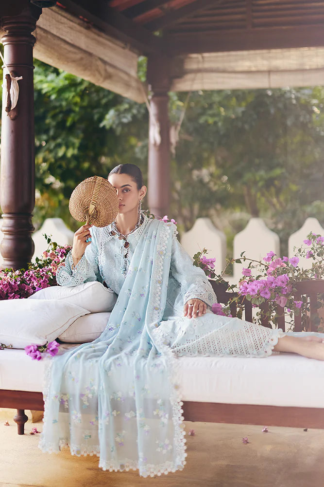Model wearing pastel blue embroidered dress from Suffuse Casual Pret 2025 Zarina. Pakistani luxury pret and Pakistani clothes online in UK.