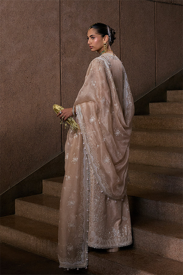 Model wearing beige embellished ensemble from Suffuse Ismira, Pakistani luxury pret, shop Pakistani clothes online in UK