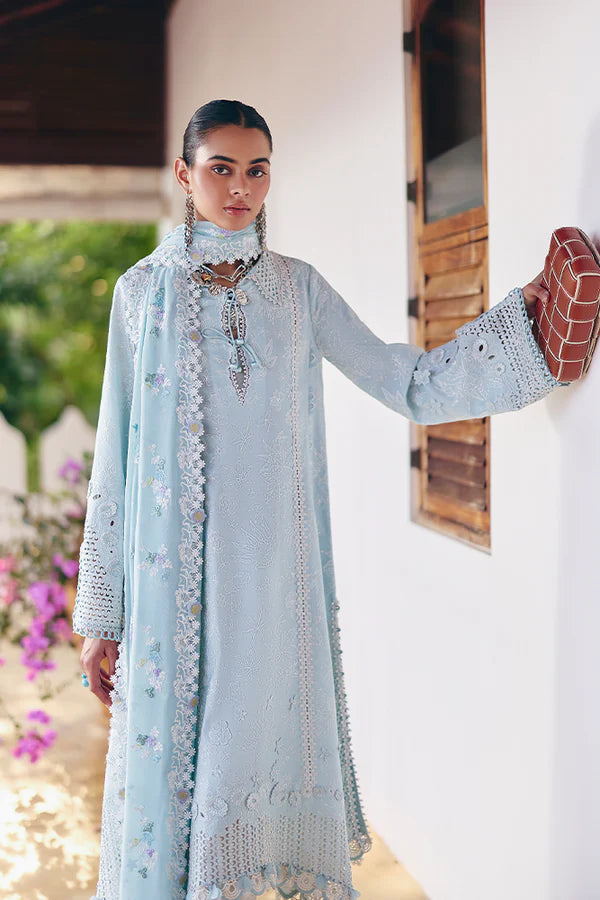 Model wearing pastel blue embroidered dress from Suffuse Casual Pret 2025 Zarina. Pakistani luxury pret and Pakistani clothes online in UK.