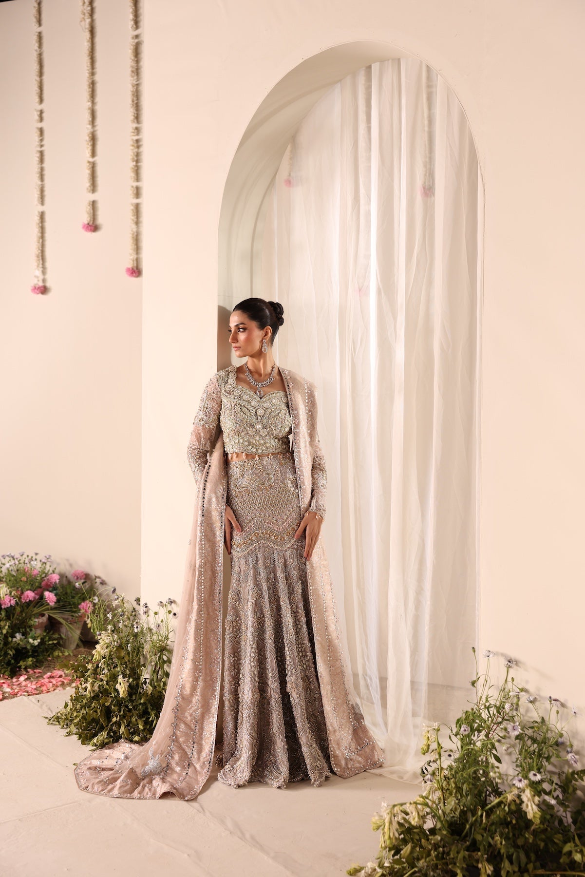 Model wearing silver and beige embellished bridal gown Salma from Mysie By Tahira Wedding Edits '25, Pakistani luxury pret online in UK.