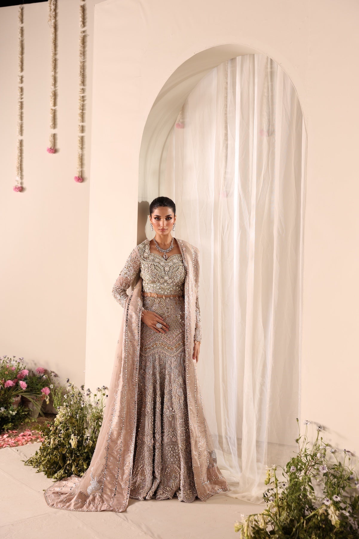 Model wearing silver and beige embellished bridal gown Salma from Mysie By Tahira Wedding Edits '25, Pakistani luxury pret online in UK.