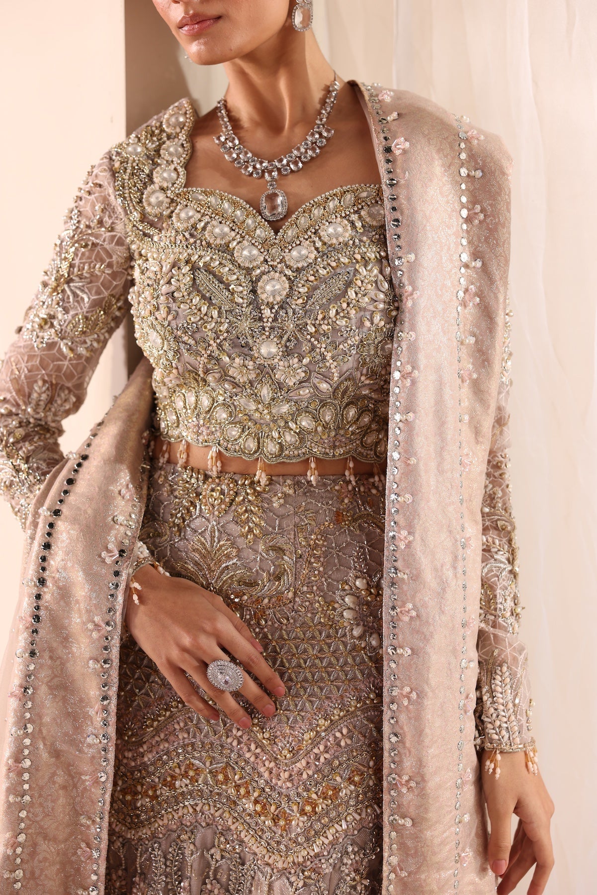 Model wearing silver and beige embellished bridal gown Salma from Mysie By Tahira Wedding Edits '25, Pakistani luxury pret online in UK.