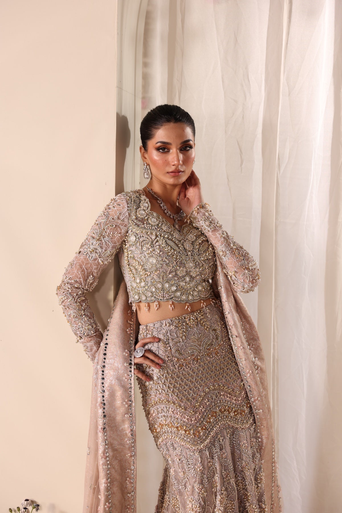 Model wearing silver and beige embellished bridal gown Salma from Mysie By Tahira Wedding Edits '25, Pakistani luxury pret online in UK.