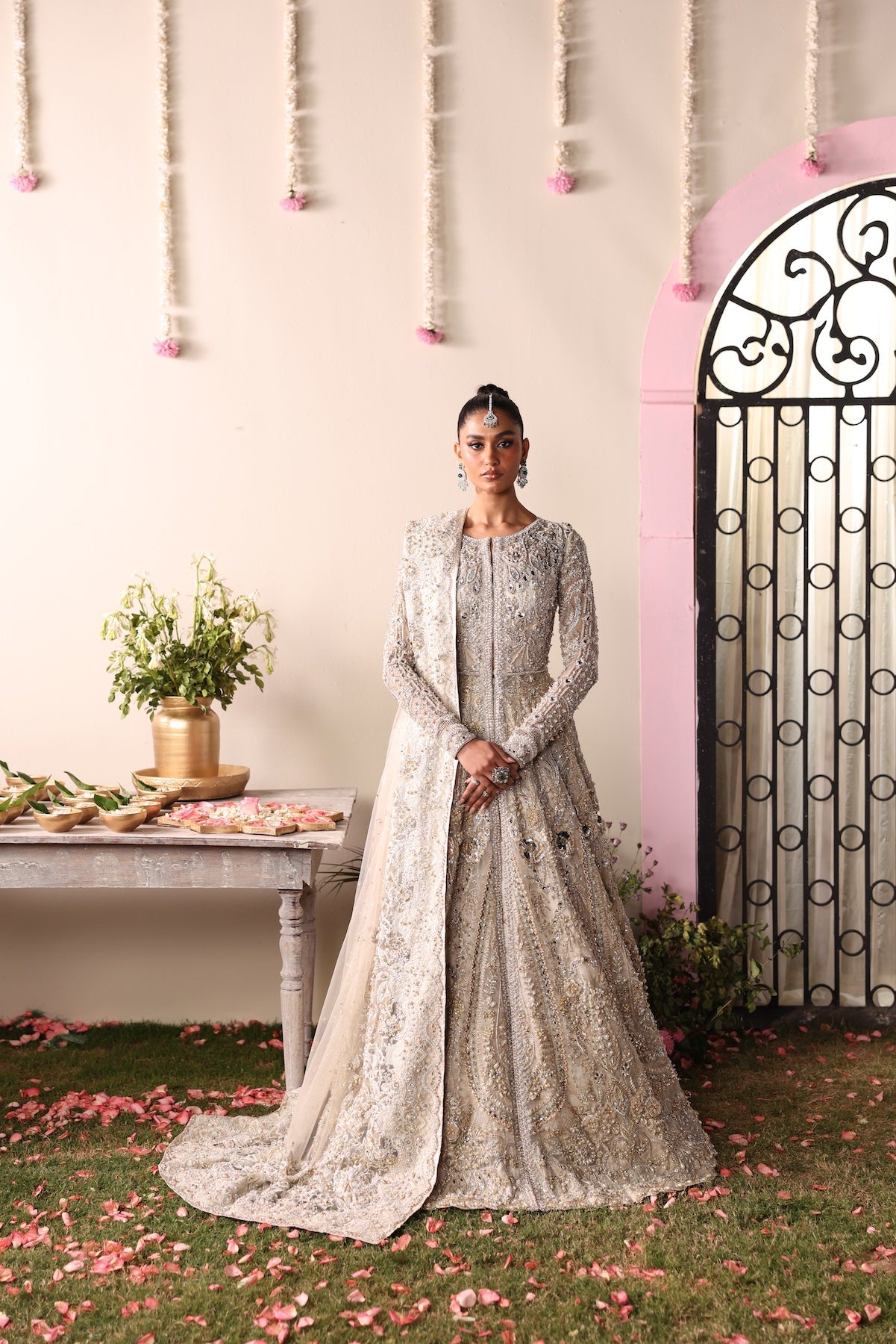 Model wearing champagne gold heavily embellished Elizabeth dress from Mysie By Tahira, Pakistani luxury pret and clothes online in UK.