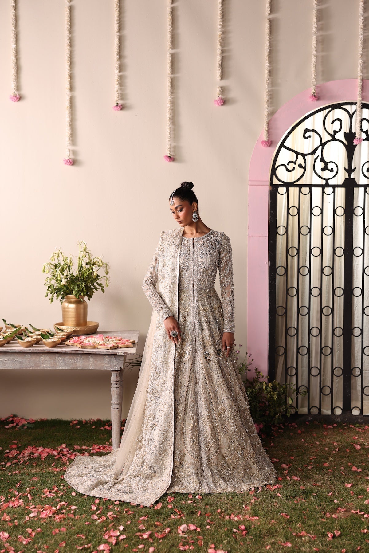 Model wearing champagne gold heavily embellished Elizabeth dress from Mysie By Tahira, Pakistani luxury pret and clothes online in UK.