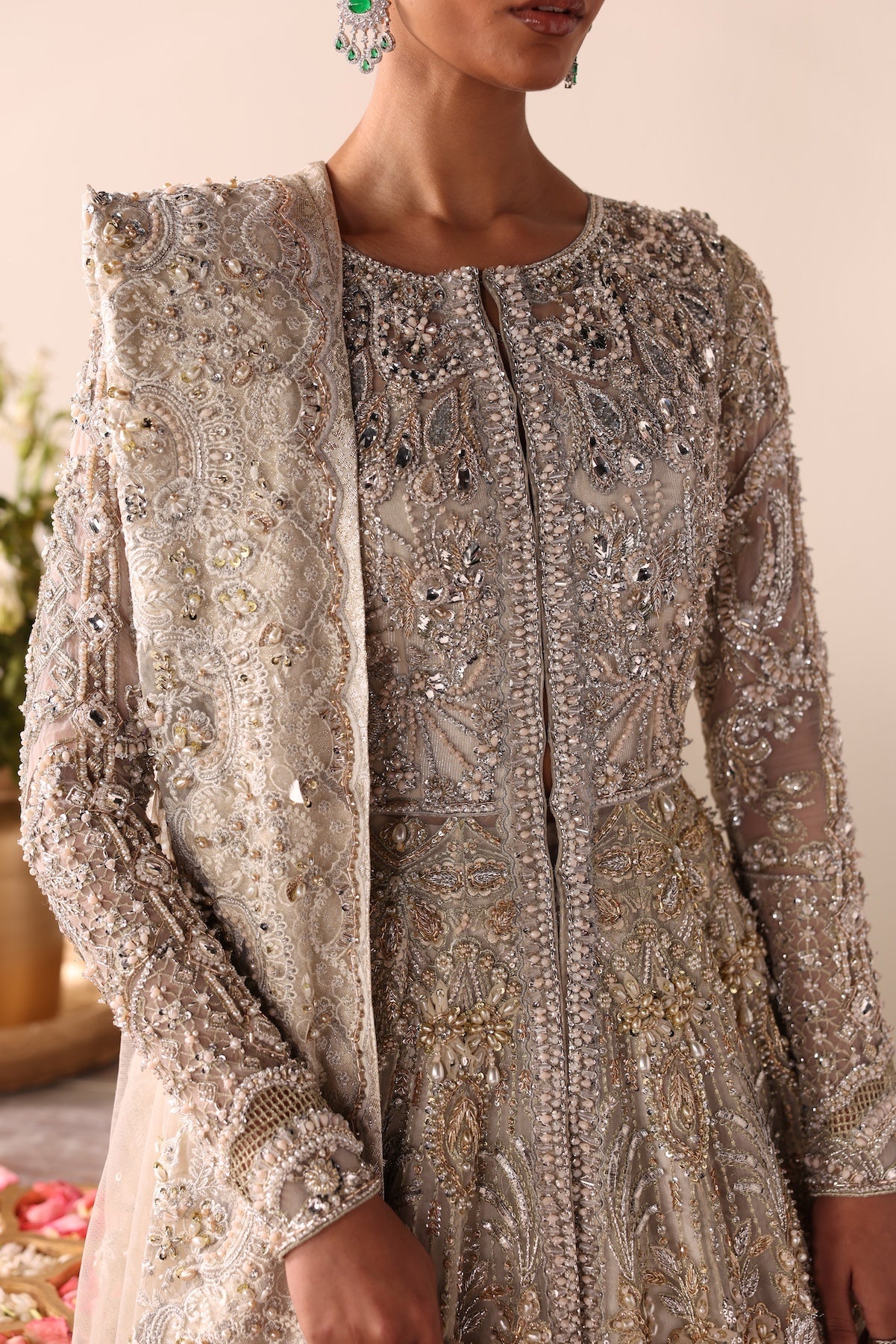 Model wearing champagne gold heavily embellished Elizabeth dress from Mysie By Tahira, Pakistani luxury pret and clothes online in UK.