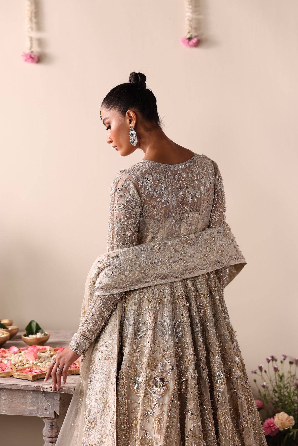 Model wearing champagne gold heavily embellished Elizabeth dress from Mysie By Tahira, Pakistani luxury pret and clothes online in UK.
