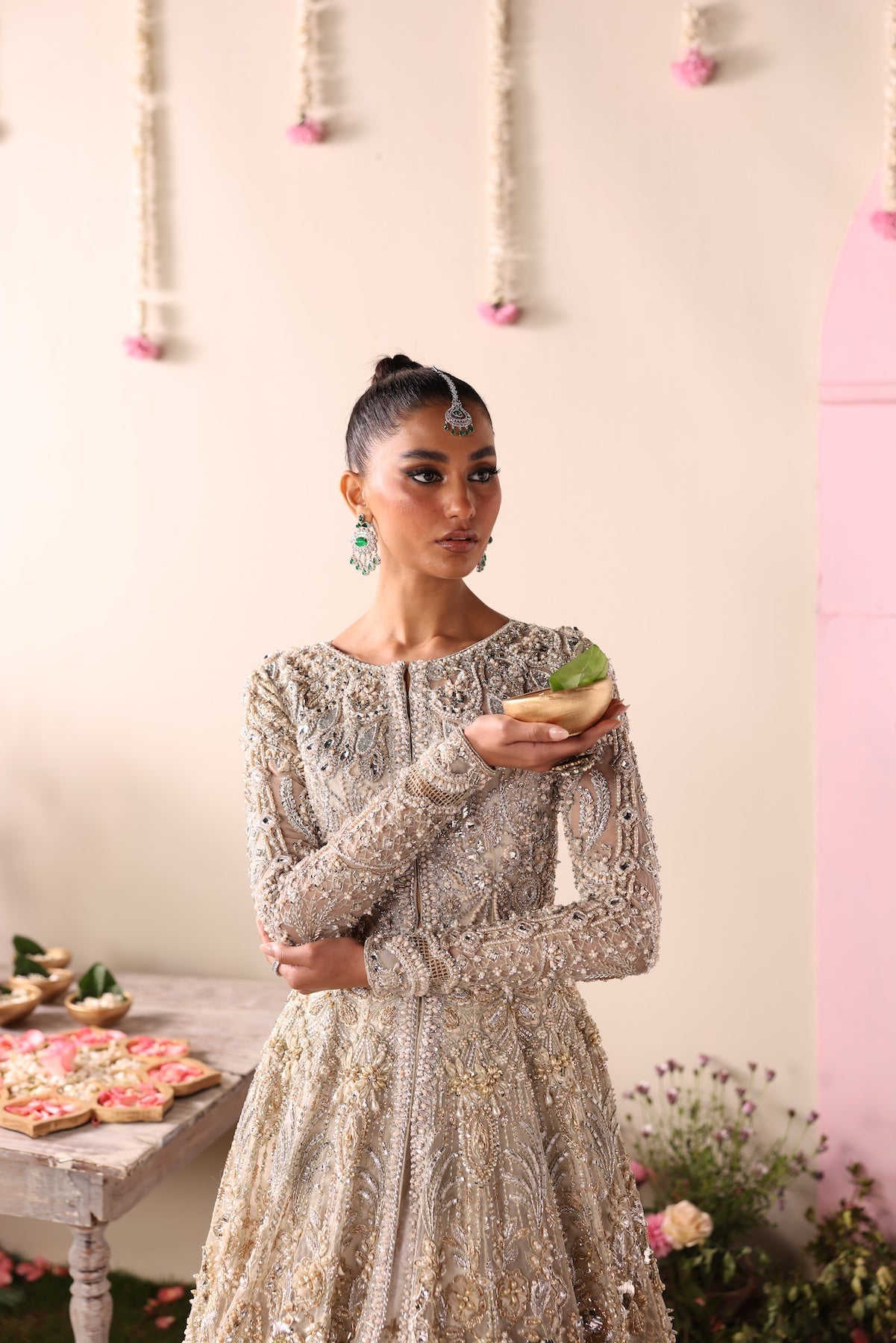 Model wearing champagne gold heavily embellished Elizabeth dress from Mysie By Tahira, Pakistani luxury pret and clothes online in UK.