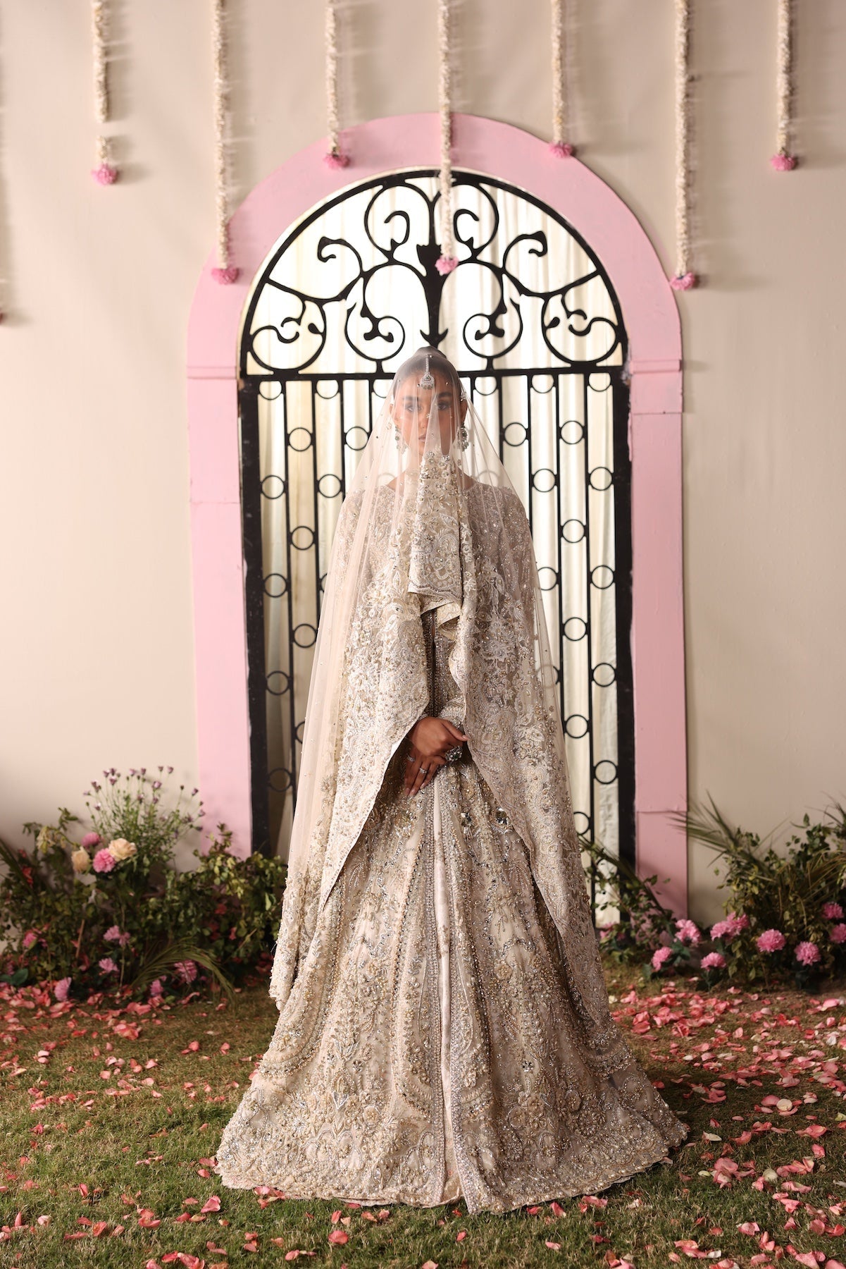 Model wearing champagne gold heavily embellished Elizabeth dress from Mysie By Tahira, Pakistani luxury pret and clothes online in UK.