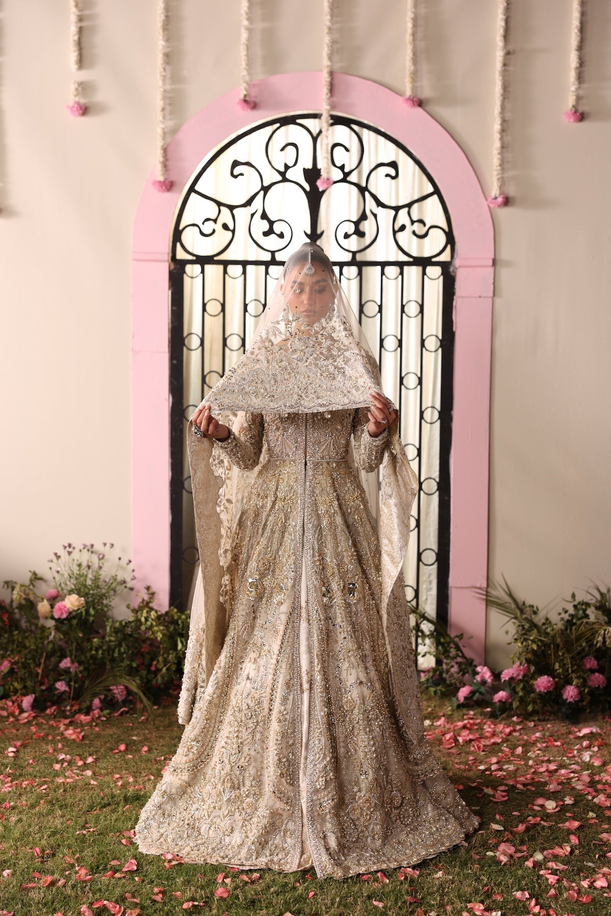 Model wearing champagne gold heavily embellished Elizabeth dress from Mysie By Tahira, Pakistani luxury pret and clothes online in UK.