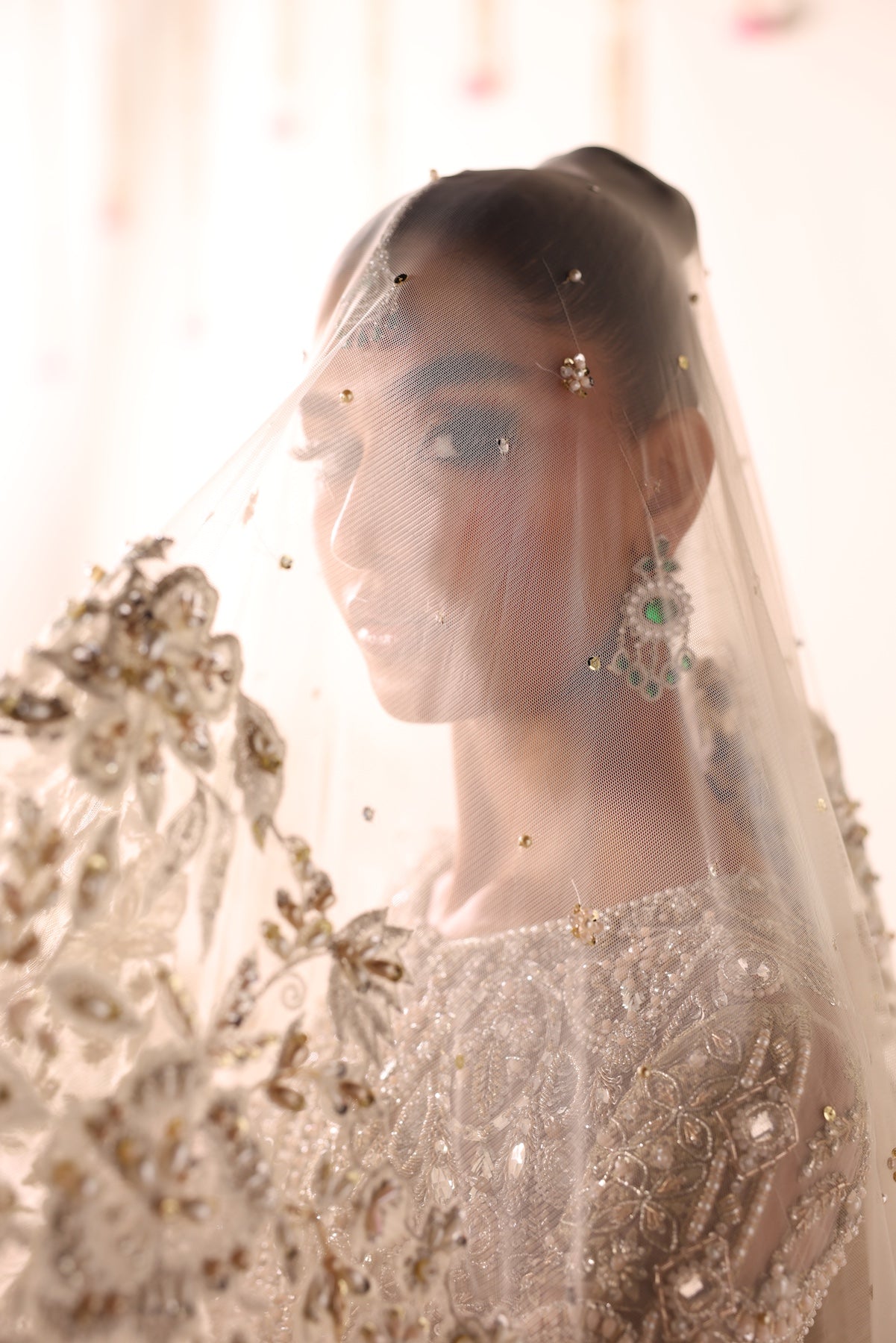 Model wearing champagne gold heavily embellished Elizabeth dress from Mysie By Tahira, Pakistani luxury pret and clothes online in UK.