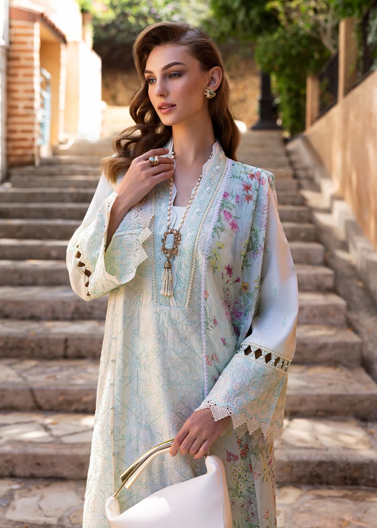 Model wearing Kanwal Malik Siena KM Basics '25 Mirel in pastel mint with floral embroidery. Shop Pakistani luxury pret online in the UK.