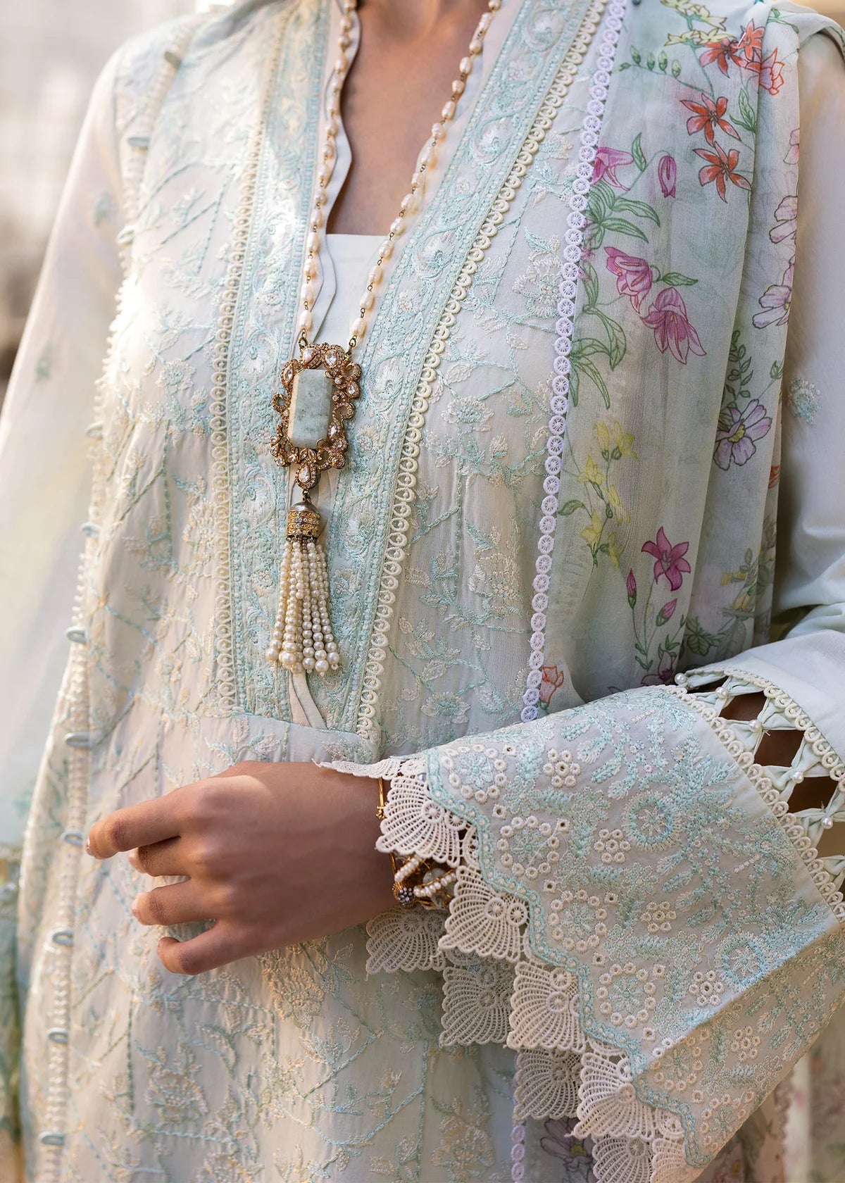 Model wearing Kanwal Malik Siena KM Basics '25 Mirel in pastel mint with floral embroidery. Shop Pakistani luxury pret online in the UK.