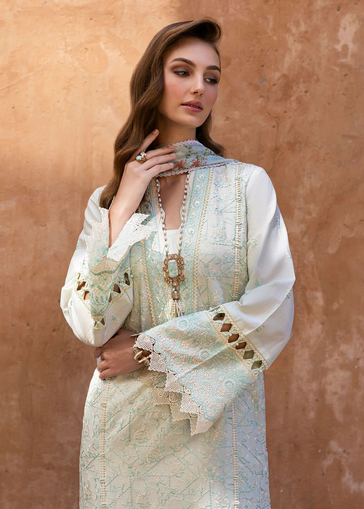 Model wearing Kanwal Malik Siena KM Basics '25 Mirel in pastel mint with floral embroidery. Shop Pakistani luxury pret online in the UK.