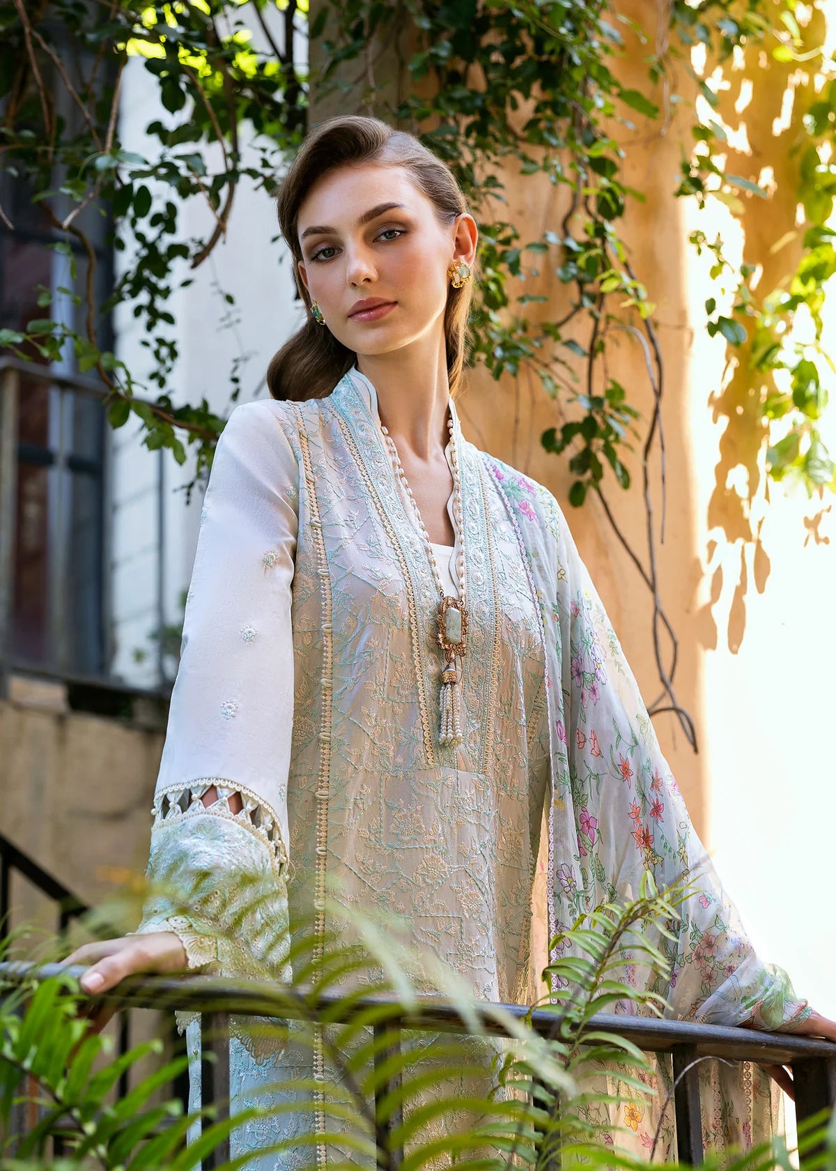 Model wearing Kanwal Malik Siena KM Basics '25 Mirel in pastel mint with floral embroidery. Shop Pakistani luxury pret online in the UK.