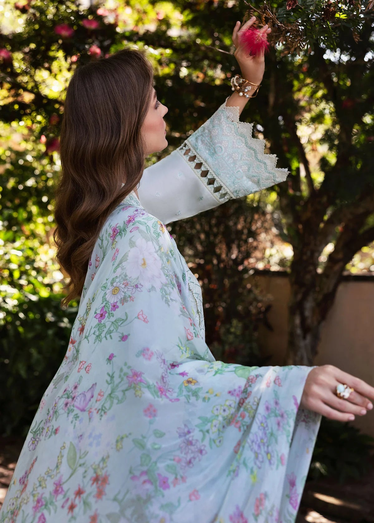 Model wearing Kanwal Malik Siena KM Basics '25 Mirel in pastel mint with floral embroidery. Shop Pakistani luxury pret online in the UK.