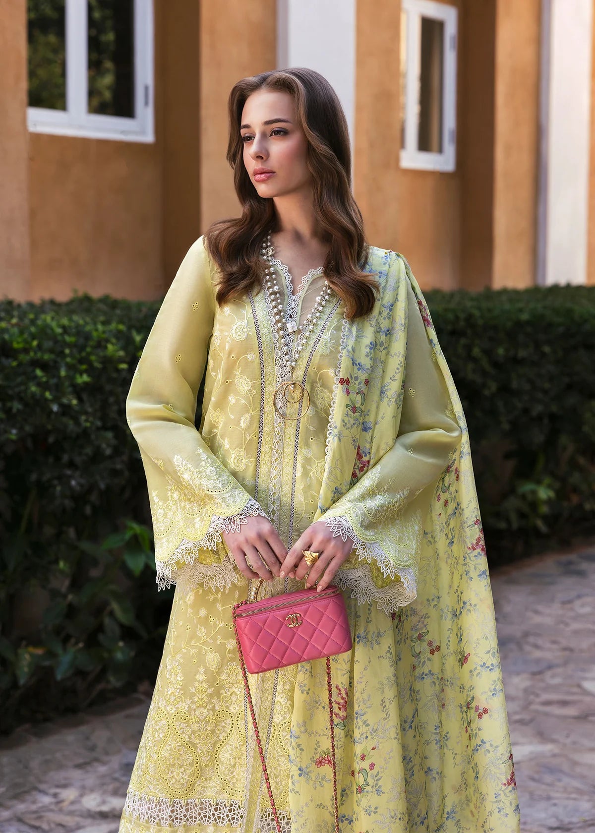 Model wearing Kanwal Malik Siena KM Basics '25 Celine in pastel yellow with floral embroidery. Shop Pakistani luxury pret online in the UK.
