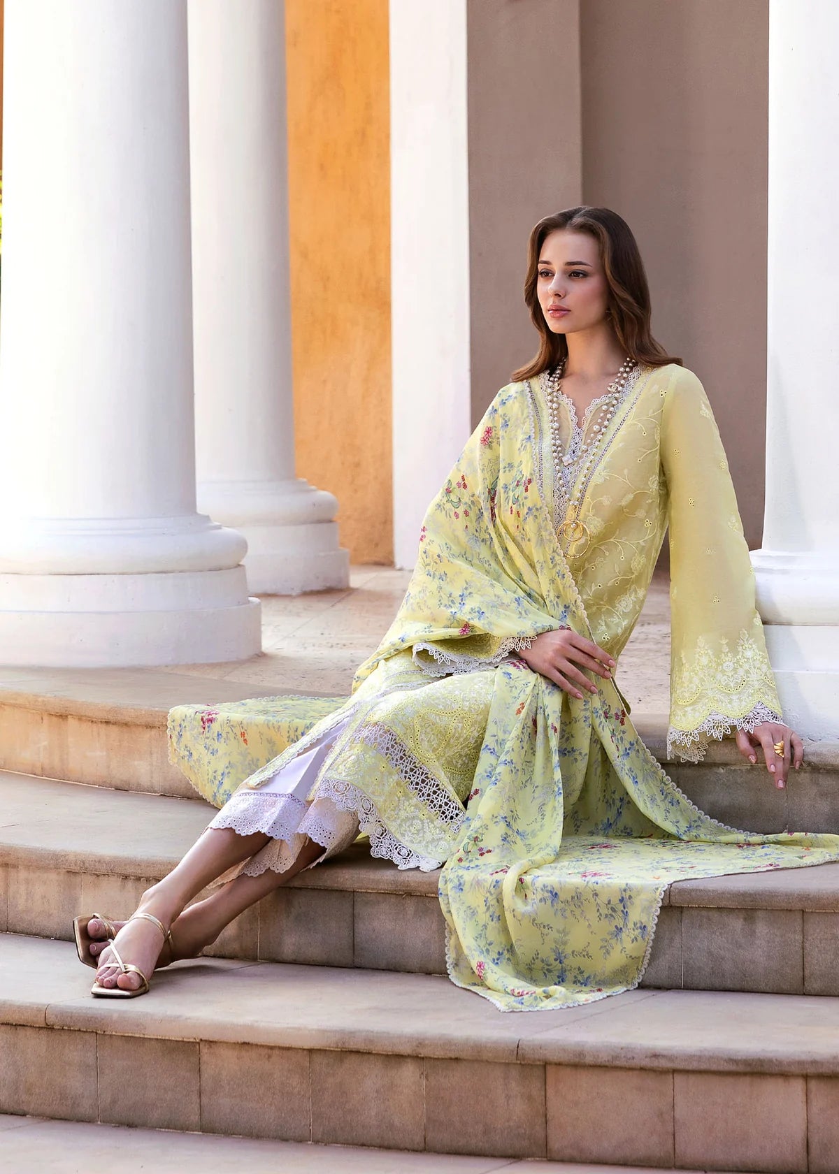 Model wearing Kanwal Malik Siena KM Basics '25 Celine in pastel yellow with floral embroidery. Shop Pakistani luxury pret online in the UK.