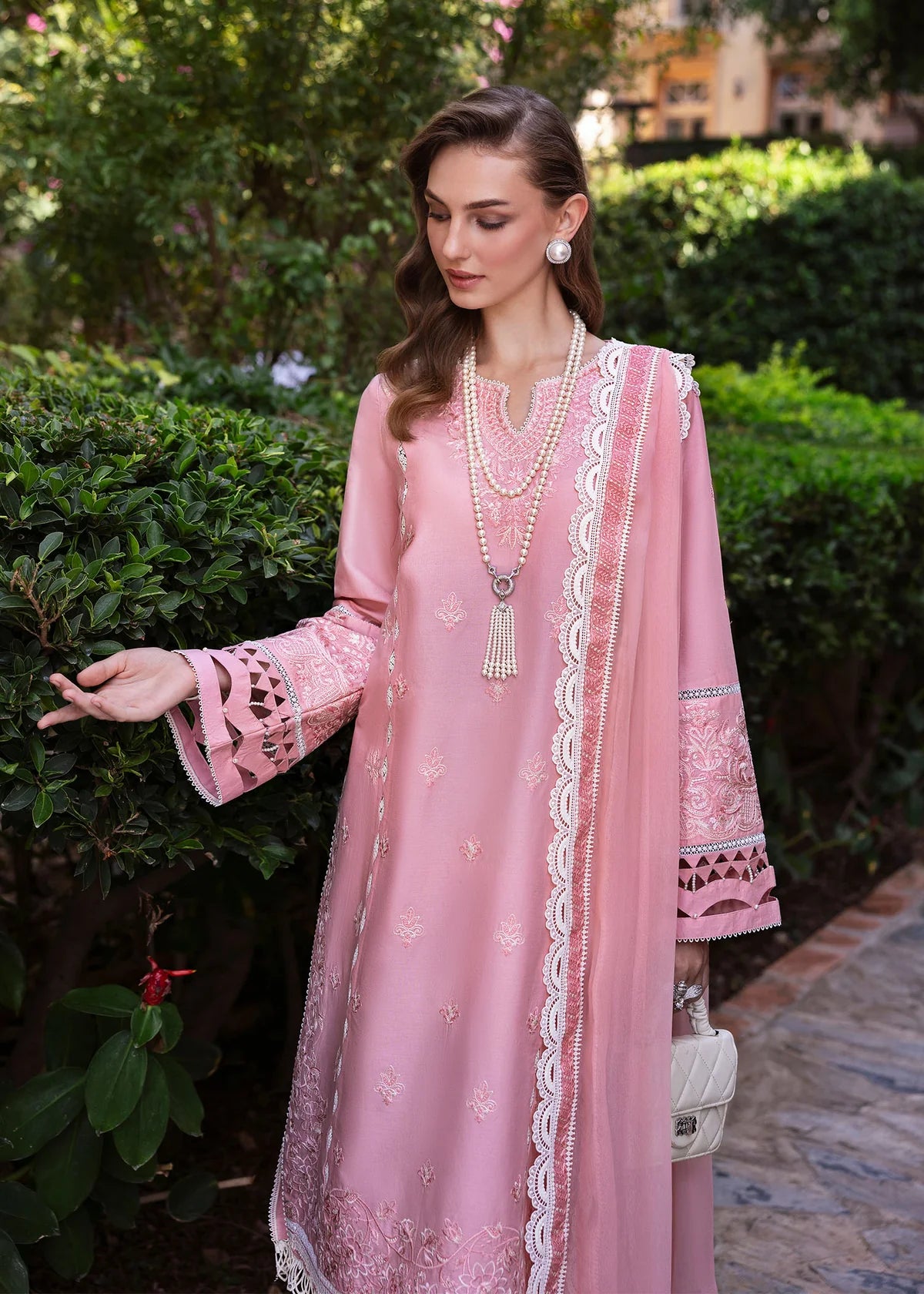 Model wearing Kanwal Malik Siena KM Basics '25 Flora in soft pink with delicate embroidery. Shop Pakistani luxury pret online in the UK.