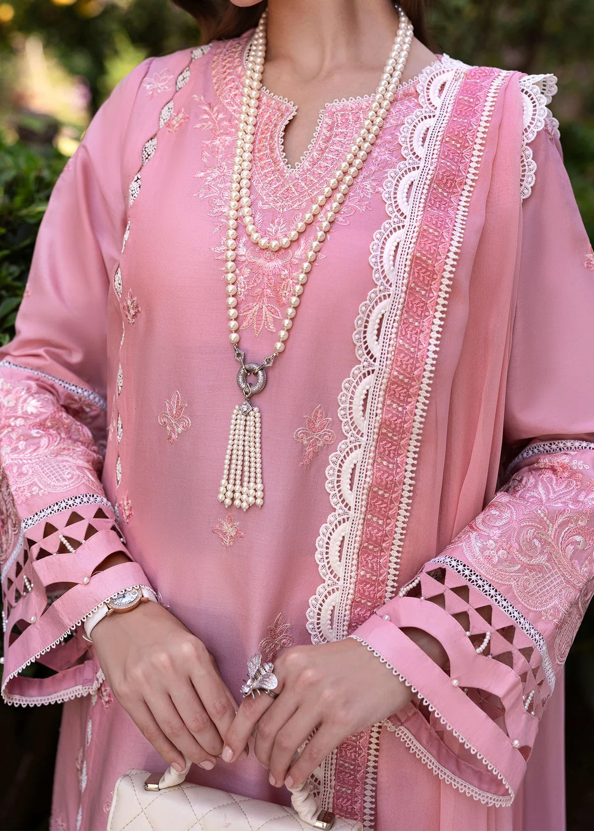 Model wearing Kanwal Malik Siena KM Basics '25 Flora in soft pink with delicate embroidery. Shop Pakistani luxury pret online in the UK.