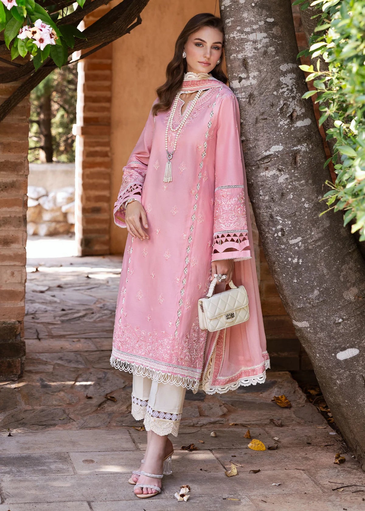Model wearing Kanwal Malik Siena KM Basics '25 Flora in soft pink with delicate embroidery. Shop Pakistani luxury pret online in the UK.