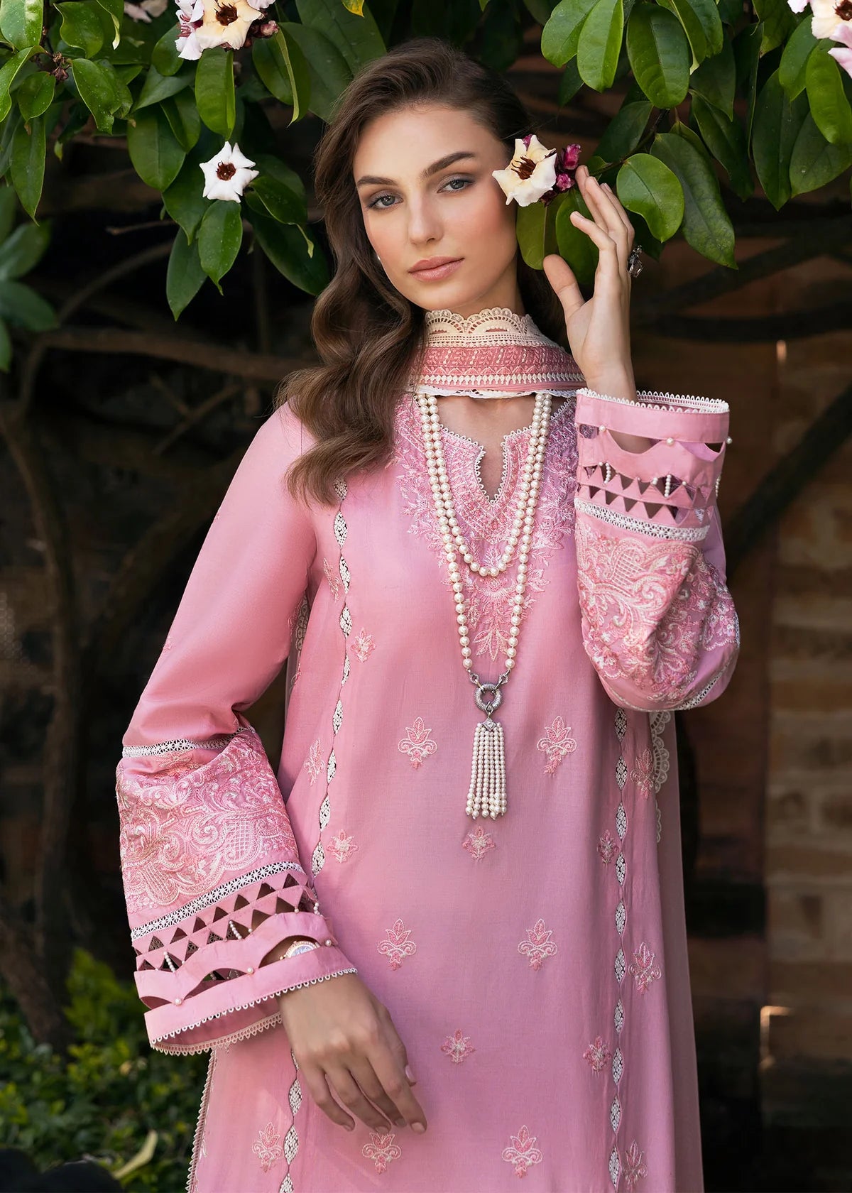Model wearing Kanwal Malik Siena KM Basics '25 Flora in soft pink with delicate embroidery. Shop Pakistani luxury pret online in the UK.