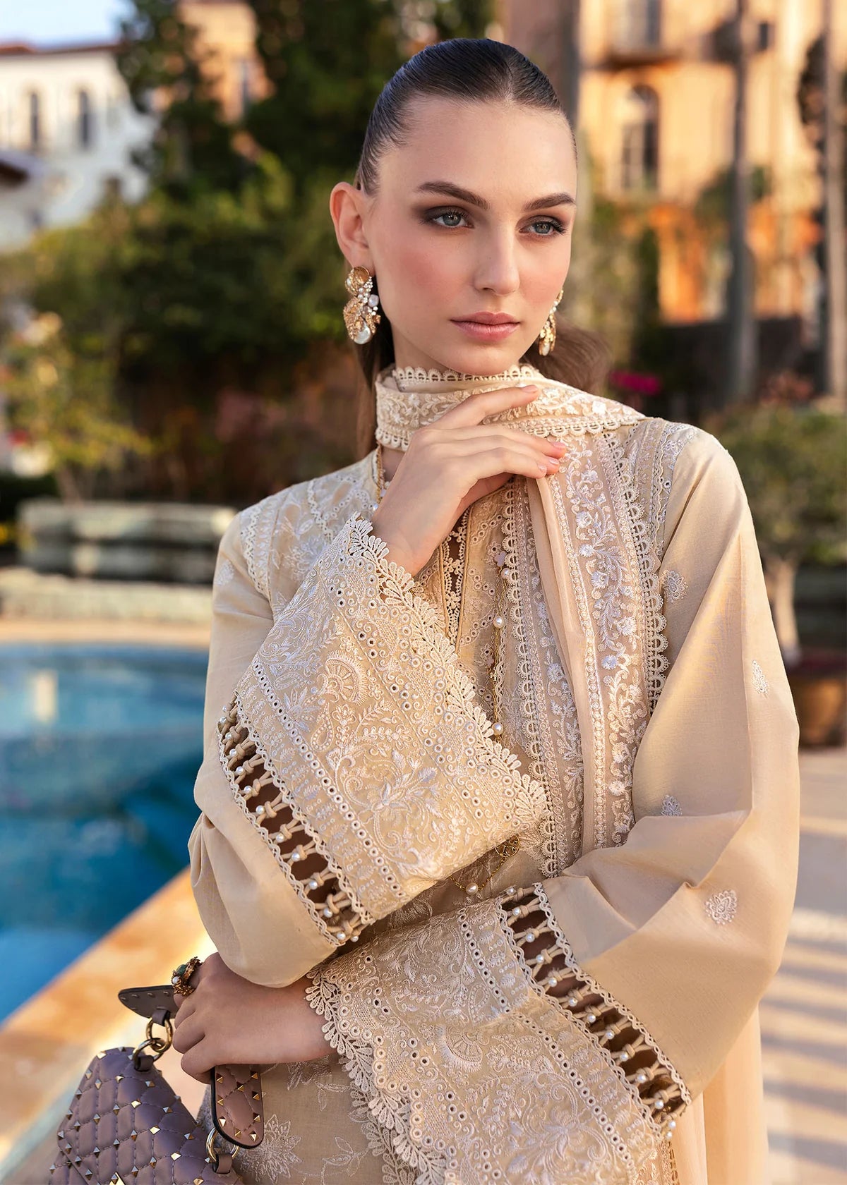 Model wearing Kanwal Malik Siena KM Basics '25 Sage in pastel beige with delicate embroidery. Shop Pakistani luxury pret online in the UK.