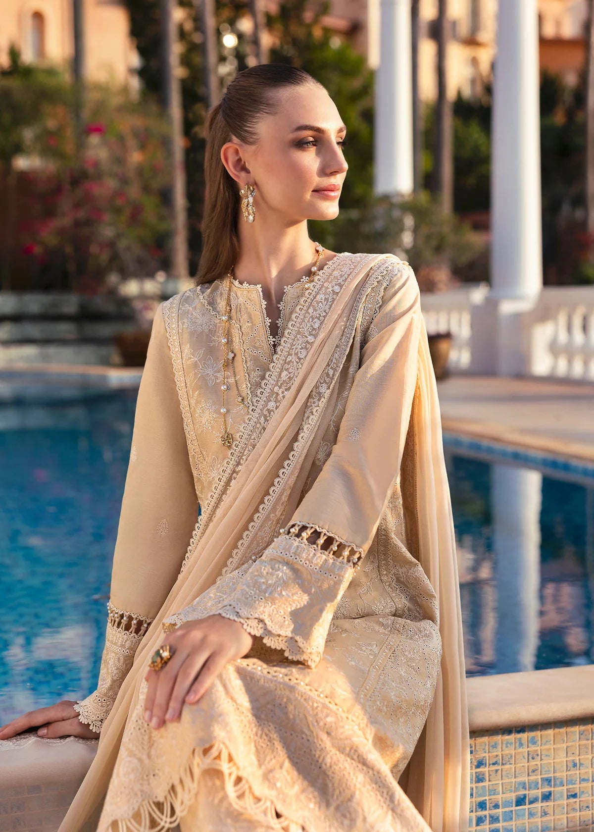 Model wearing Kanwal Malik Siena KM Basics '25 Sage in pastel beige with delicate embroidery. Shop Pakistani luxury pret online in the UK.