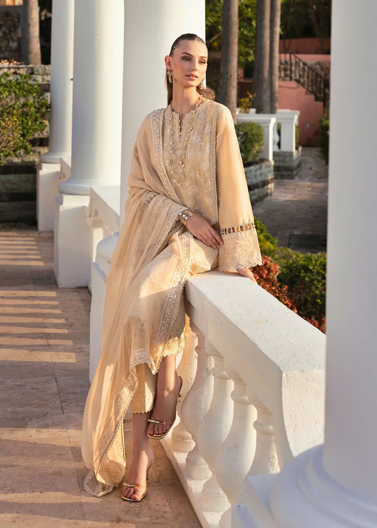 Model wearing Kanwal Malik Siena KM Basics '25 Sage in pastel beige with delicate embroidery. Shop Pakistani luxury pret online in the UK.