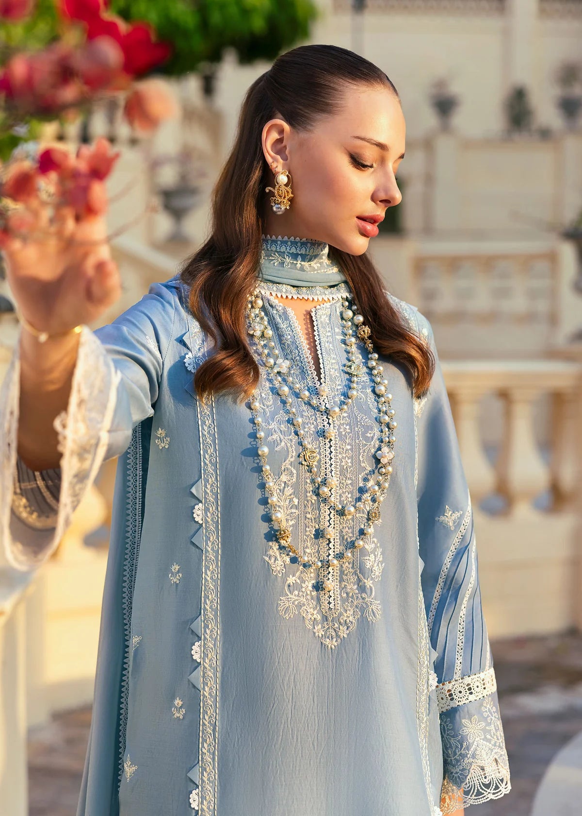 Model wearing Kanwal Malik Siena KM Basics '25 Kiara in pastel blue with delicate embroidery. Shop Pakistani luxury pret online in the UK.