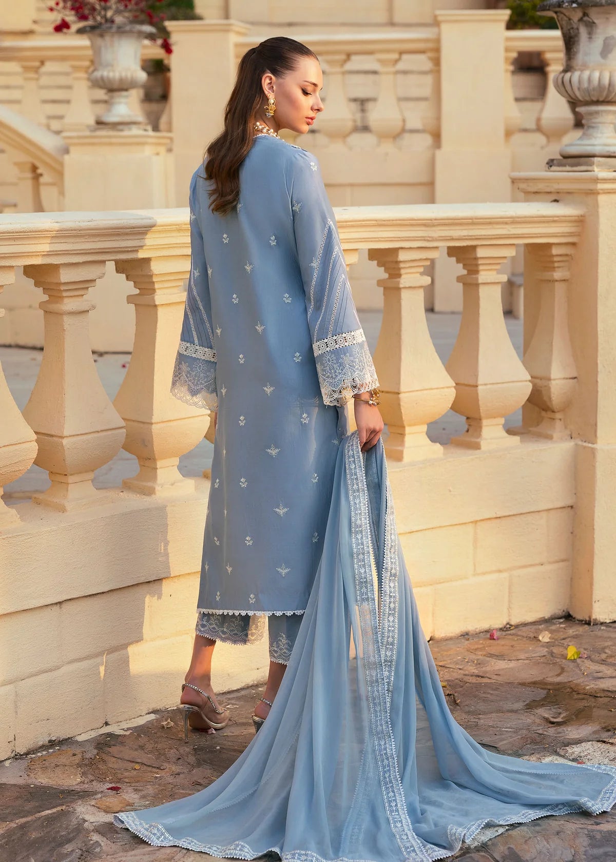 Model wearing Kanwal Malik Siena KM Basics '25 Kiara in pastel blue with delicate embroidery. Shop Pakistani luxury pret online in the UK.