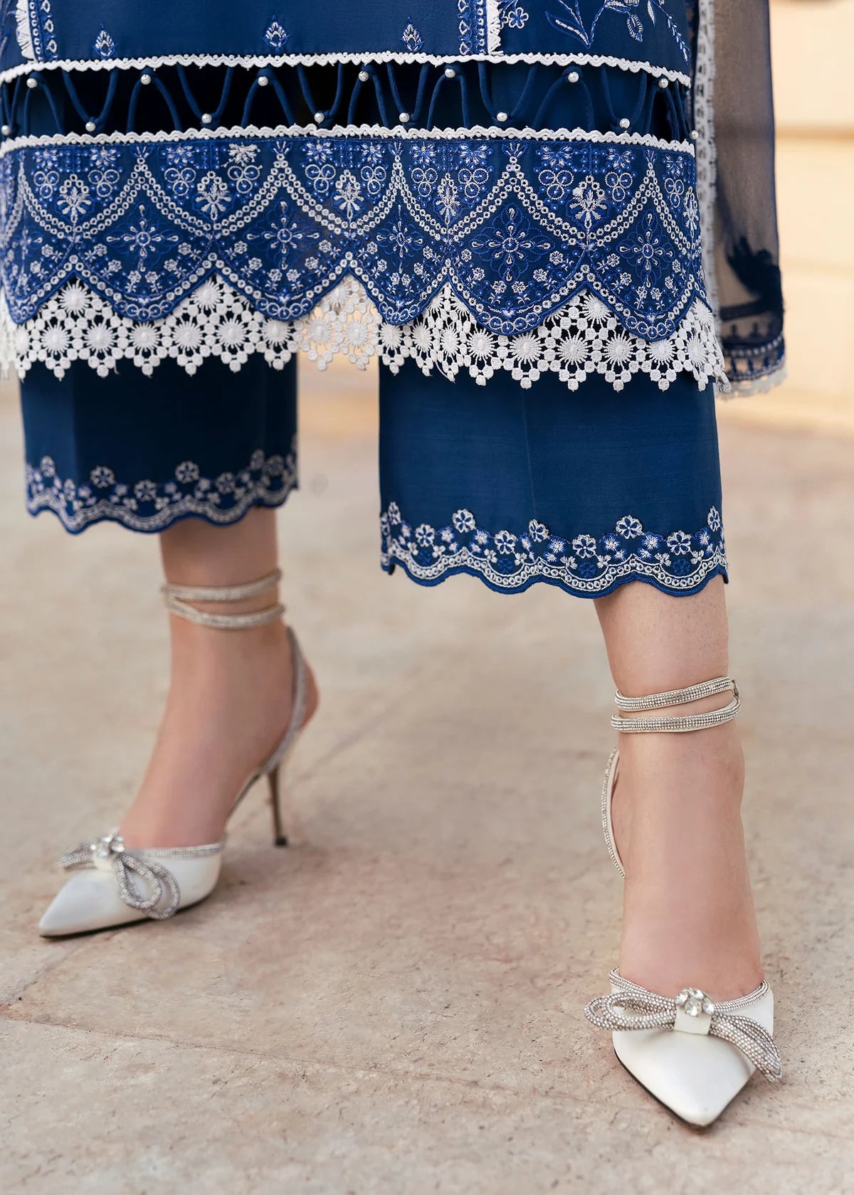 Model wearing Kanwal Malik Siena KM Basics '25 Zuha in navy blue with intricate embroidery. Shop Pakistani luxury pret online in the UK.