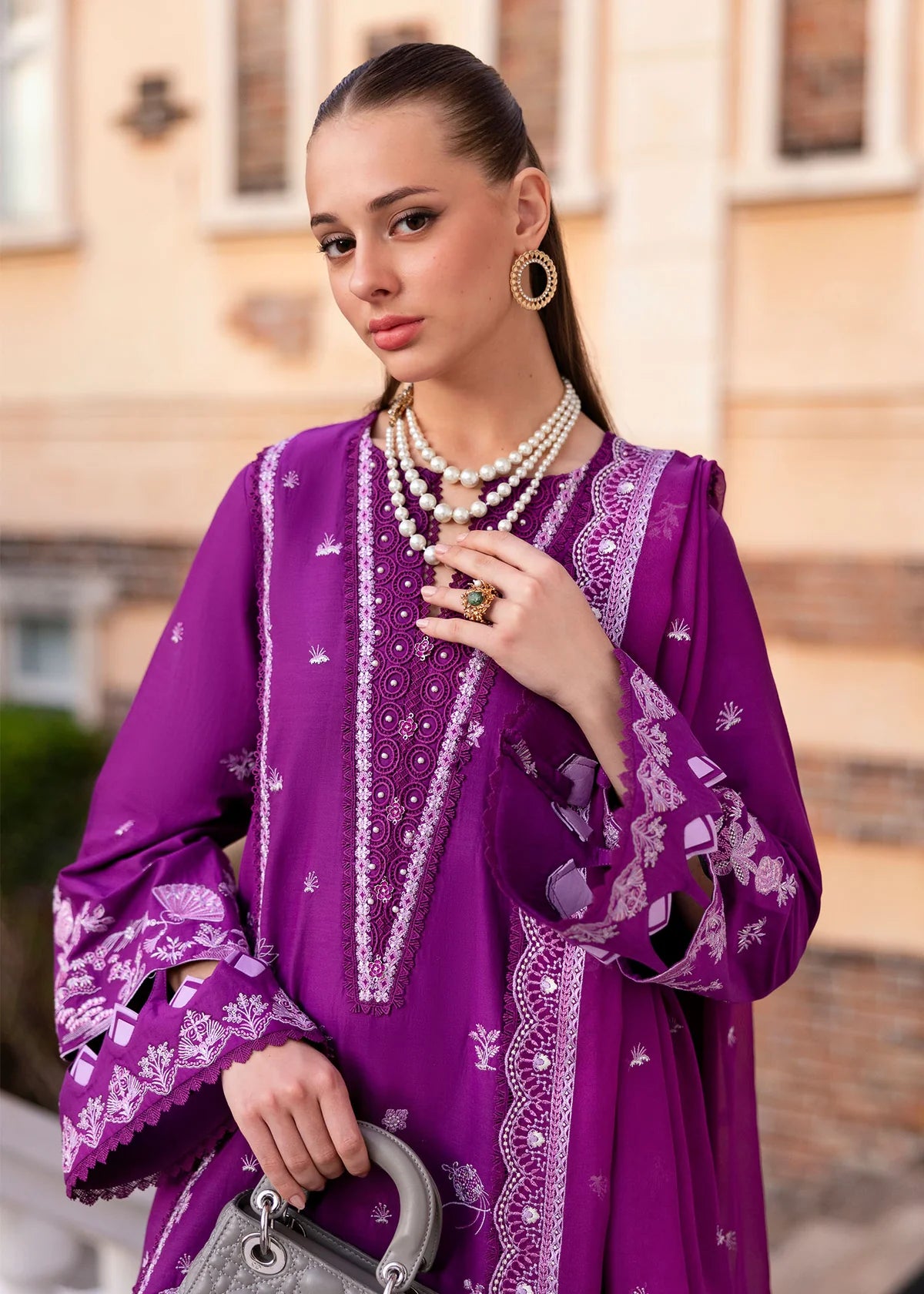 Model wearing Kanwal Malik Siena KM Basics '25 Cyra in purple with intricate embroidery. Shop Pakistani luxury pret online in the UK.