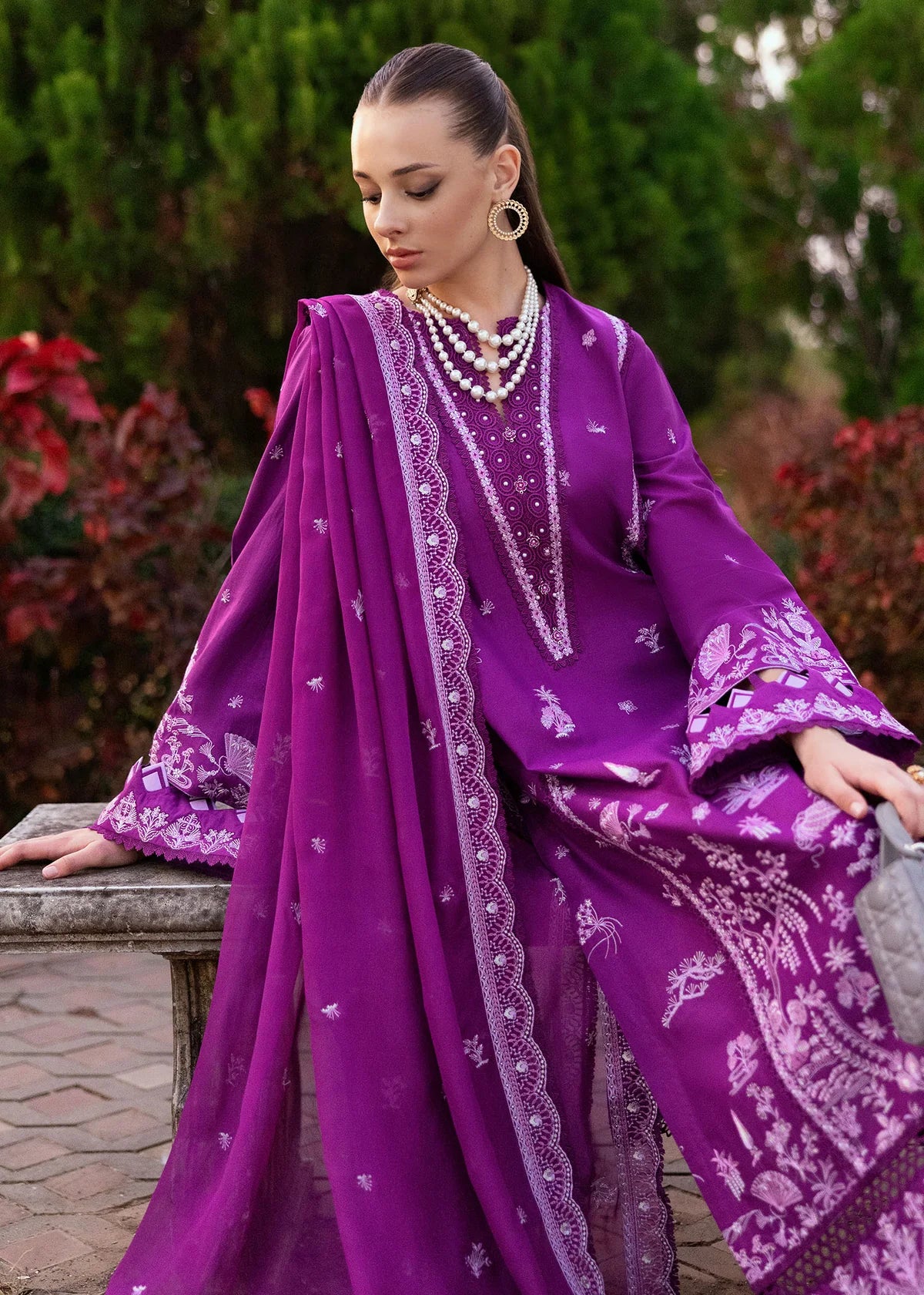 Model wearing Kanwal Malik Siena KM Basics '25 Cyra in purple with intricate embroidery. Shop Pakistani luxury pret online in the UK.