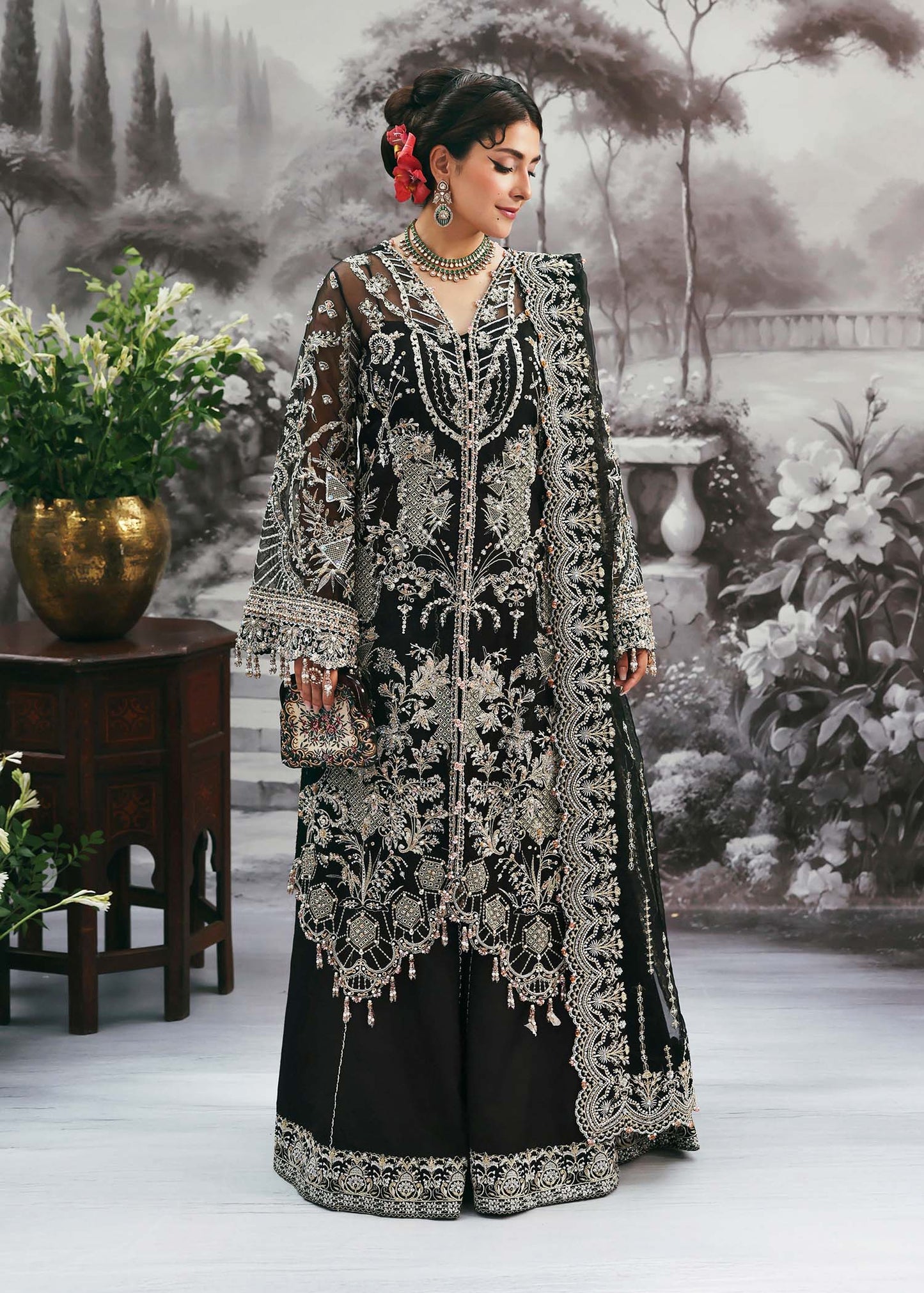 Model wearing Huriya by Kanwal Malik in black heavily embroidered outfit – Pakistani luxury pret available online in UK for festive wear.