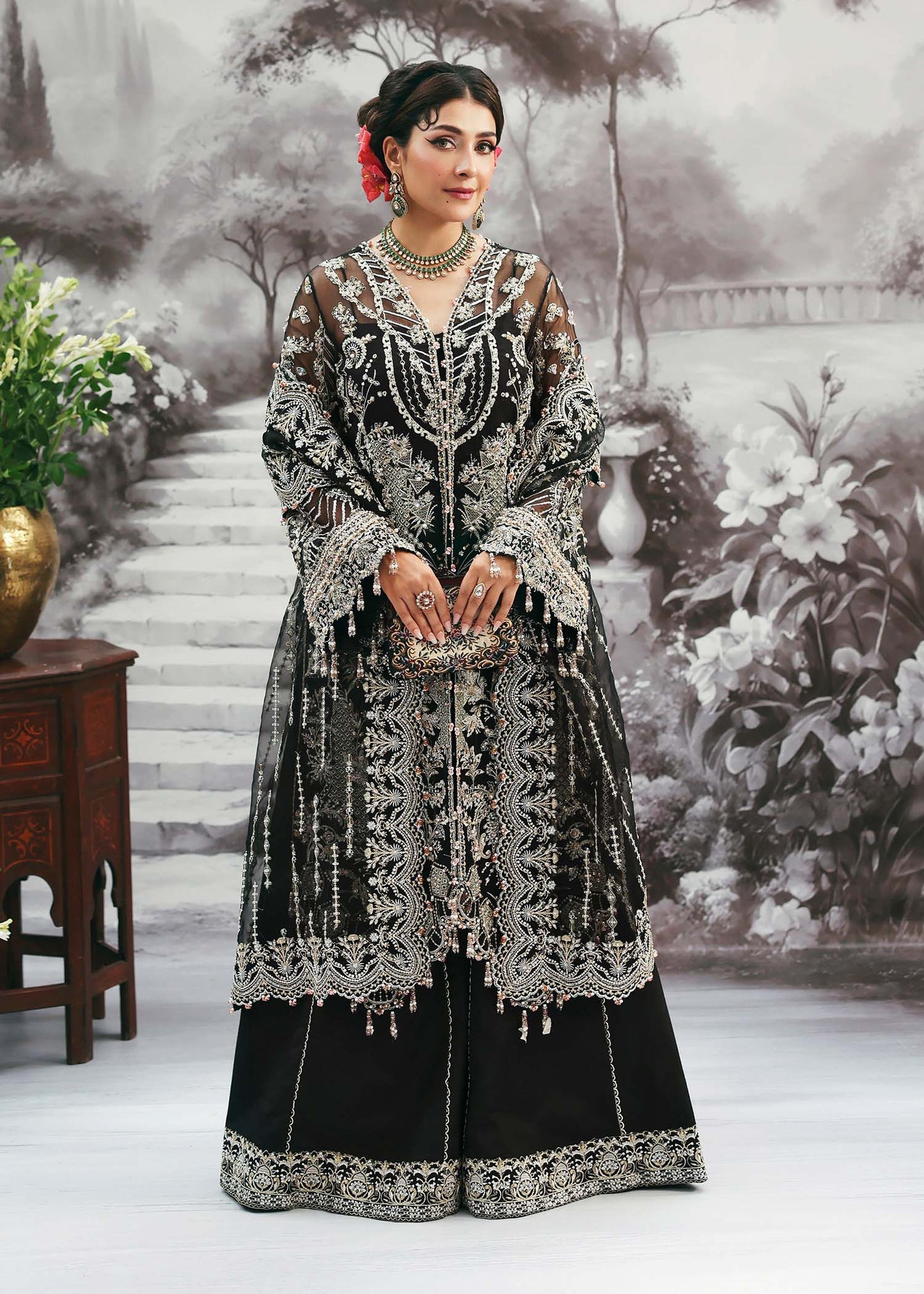 Model wearing Huriya by Kanwal Malik in black heavily embroidered outfit – Pakistani luxury pret available online in UK for festive wear.