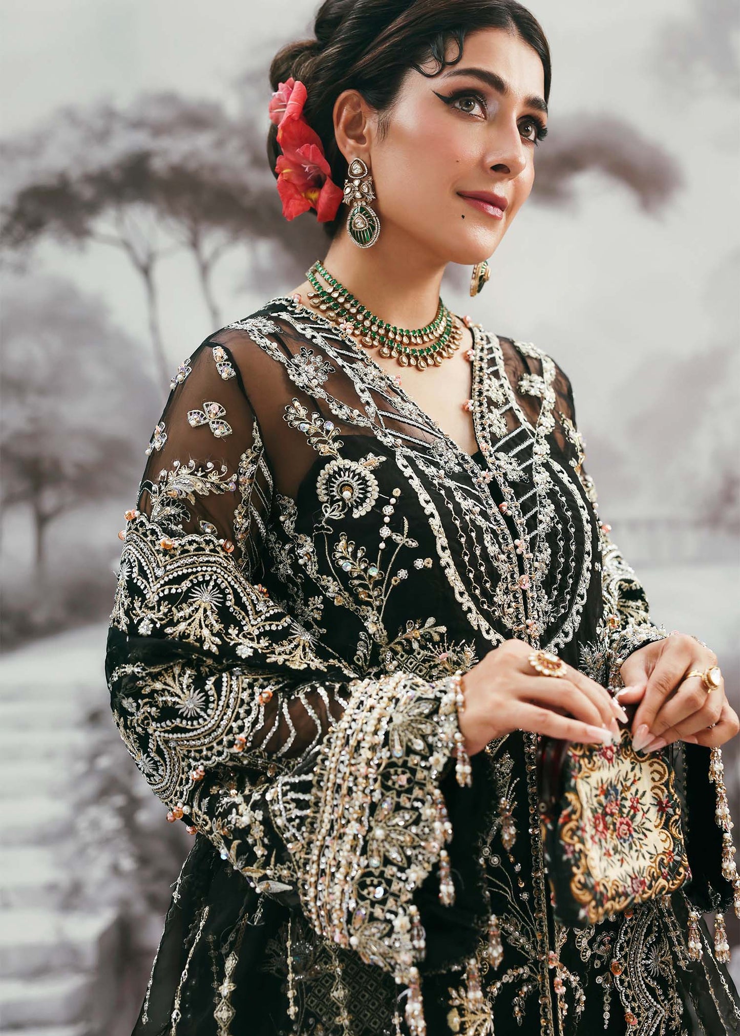Model wearing Huriya by Kanwal Malik in black heavily embroidered outfit – Pakistani luxury pret available online in UK for festive wear.