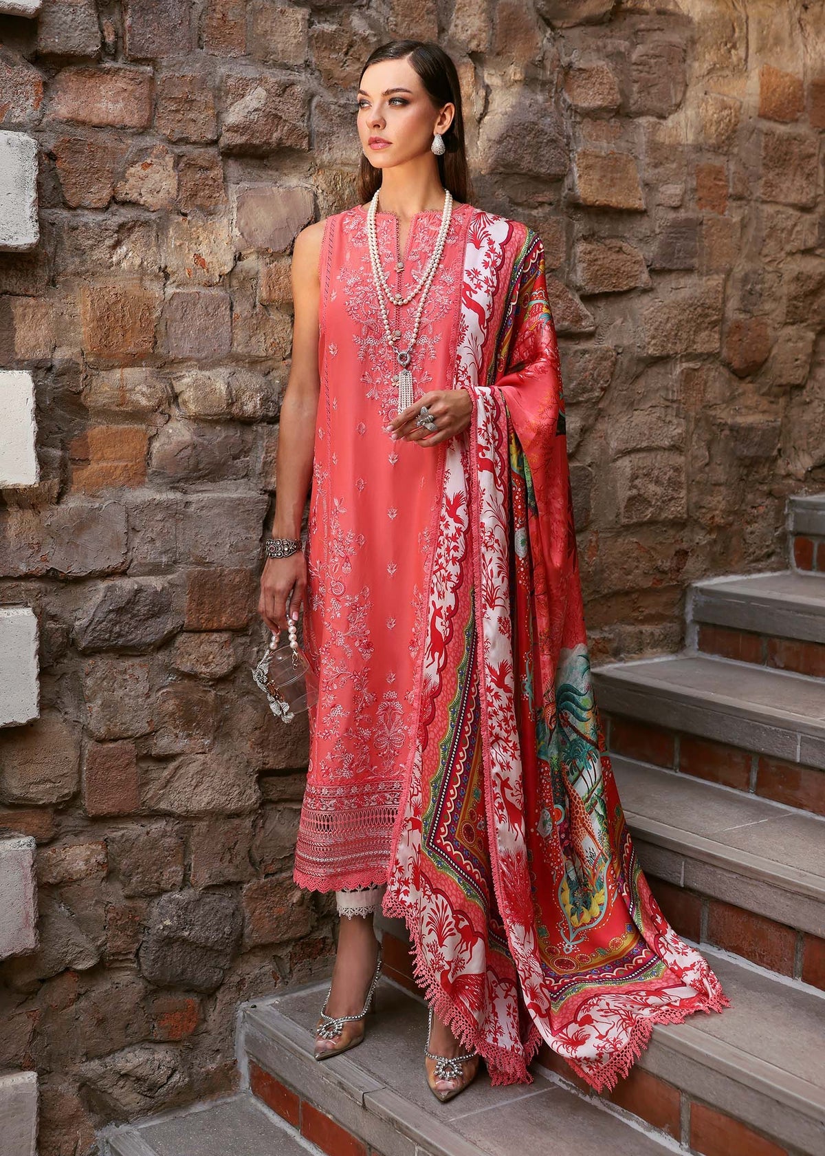 Model wearing coral red Aanya dress from Kanwal Malik Zaina Lawn '25, perfect for Pakistani luxury pret and Pakistani clothes online in UK.