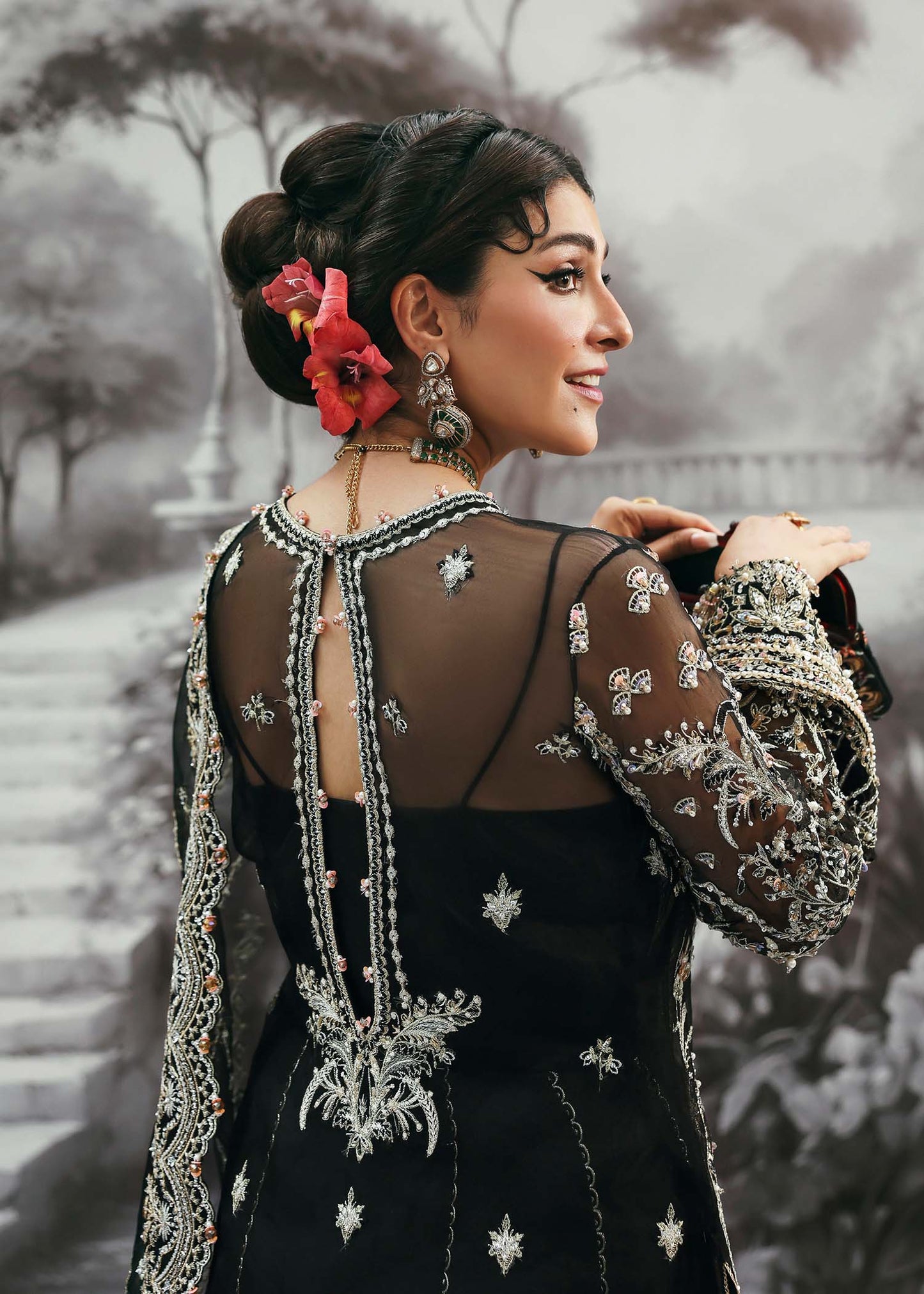 Model wearing Huriya by Kanwal Malik in black heavily embroidered outfit – Pakistani luxury pret available online in UK for festive wear.