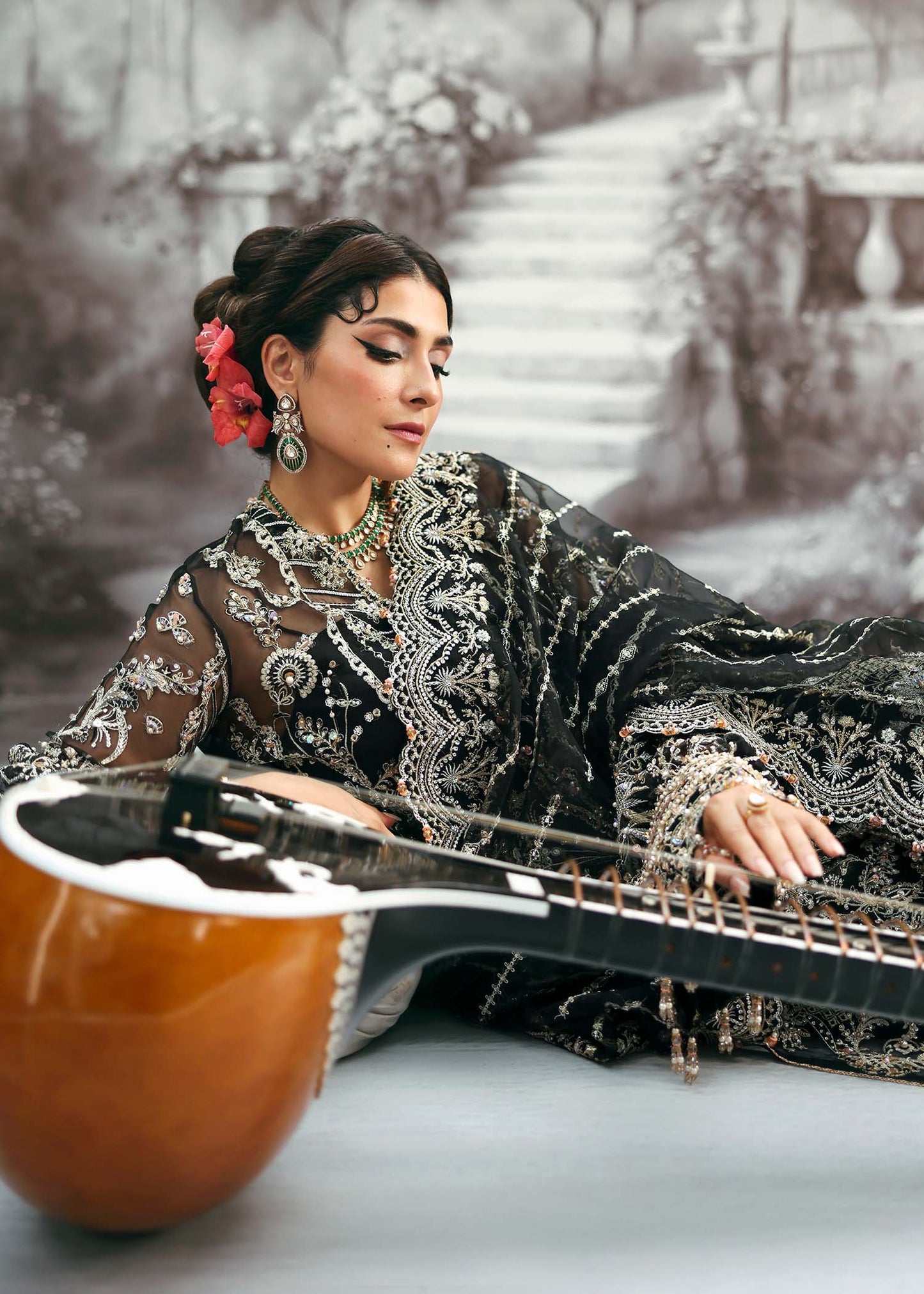 Model wearing Huriya by Kanwal Malik in black heavily embroidered outfit – Pakistani luxury pret available online in UK for festive wear.