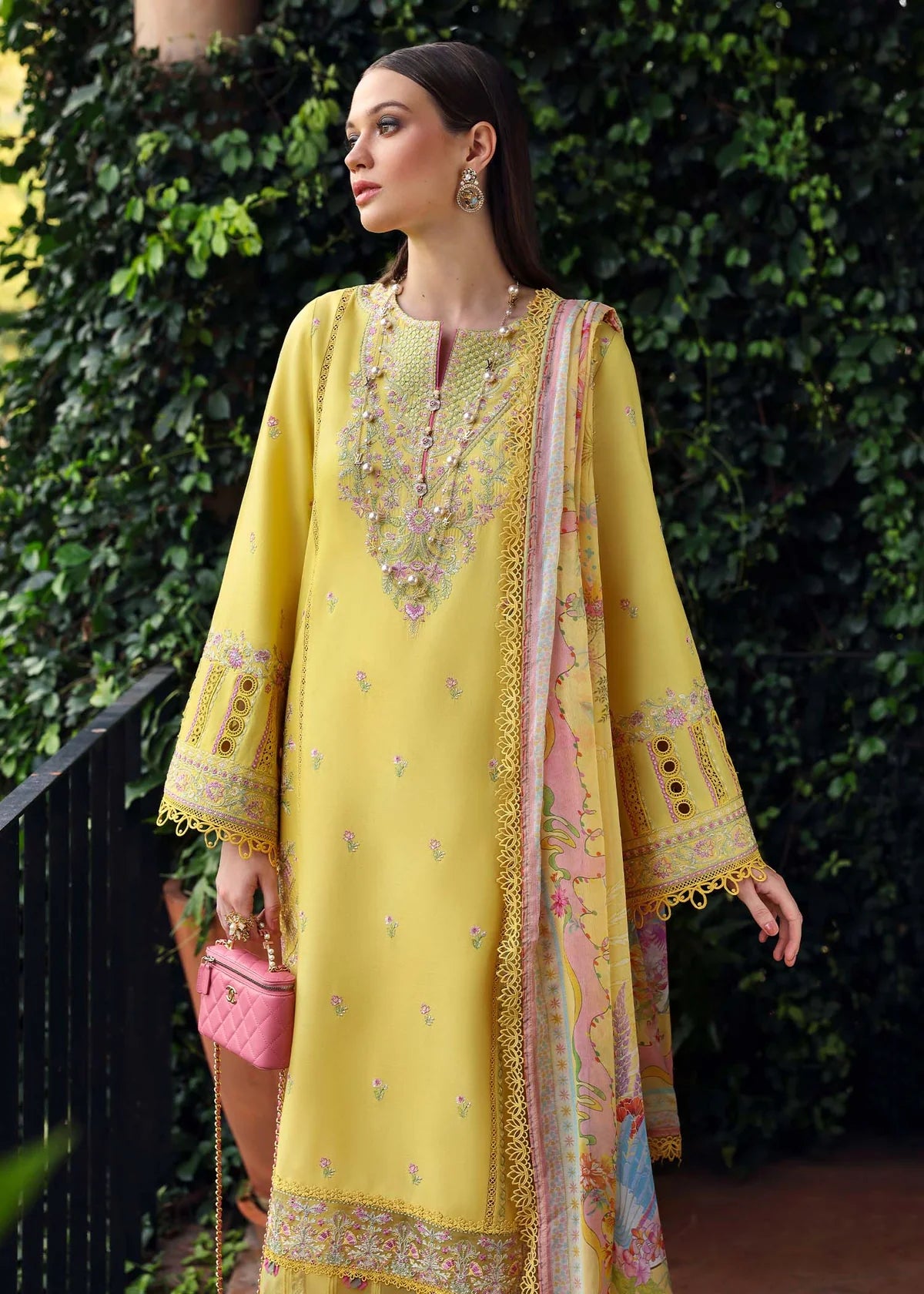 Model wearing yellow embroidered Raiha dress from Kanwal Malik Zaina Lawn '25, ideal for Pakistani luxury pret and clothes online in UK.