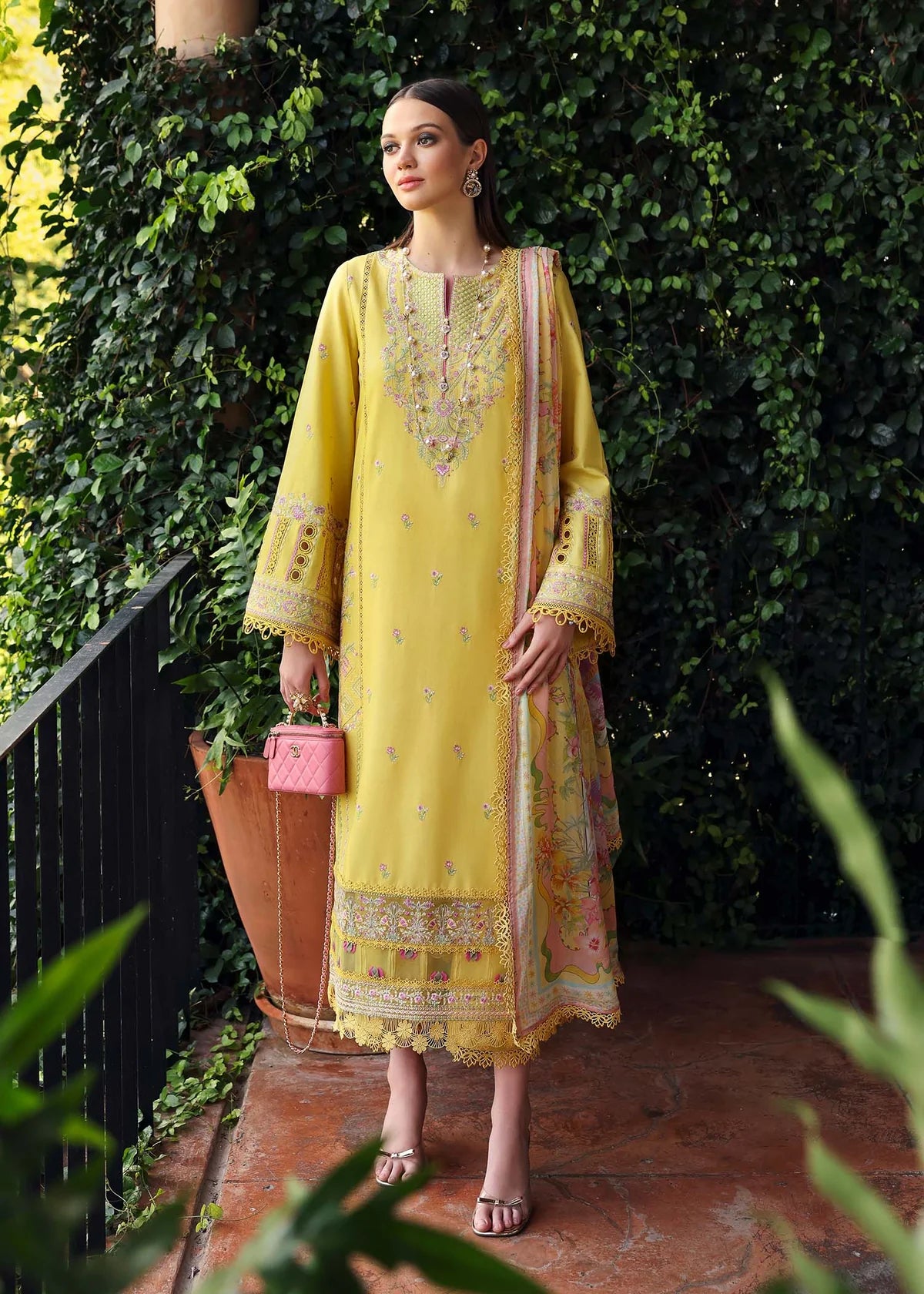 Model wearing yellow embroidered Raiha dress from Kanwal Malik Zaina Lawn '25, ideal for Pakistani luxury pret and clothes online in UK.