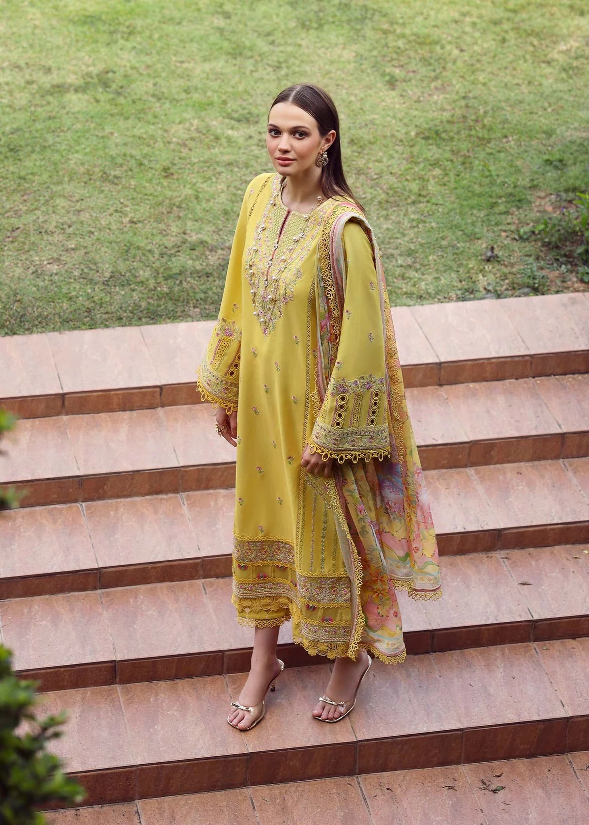 Model wearing yellow embroidered Raiha dress from Kanwal Malik Zaina Lawn '25, ideal for Pakistani luxury pret and clothes online in UK.
