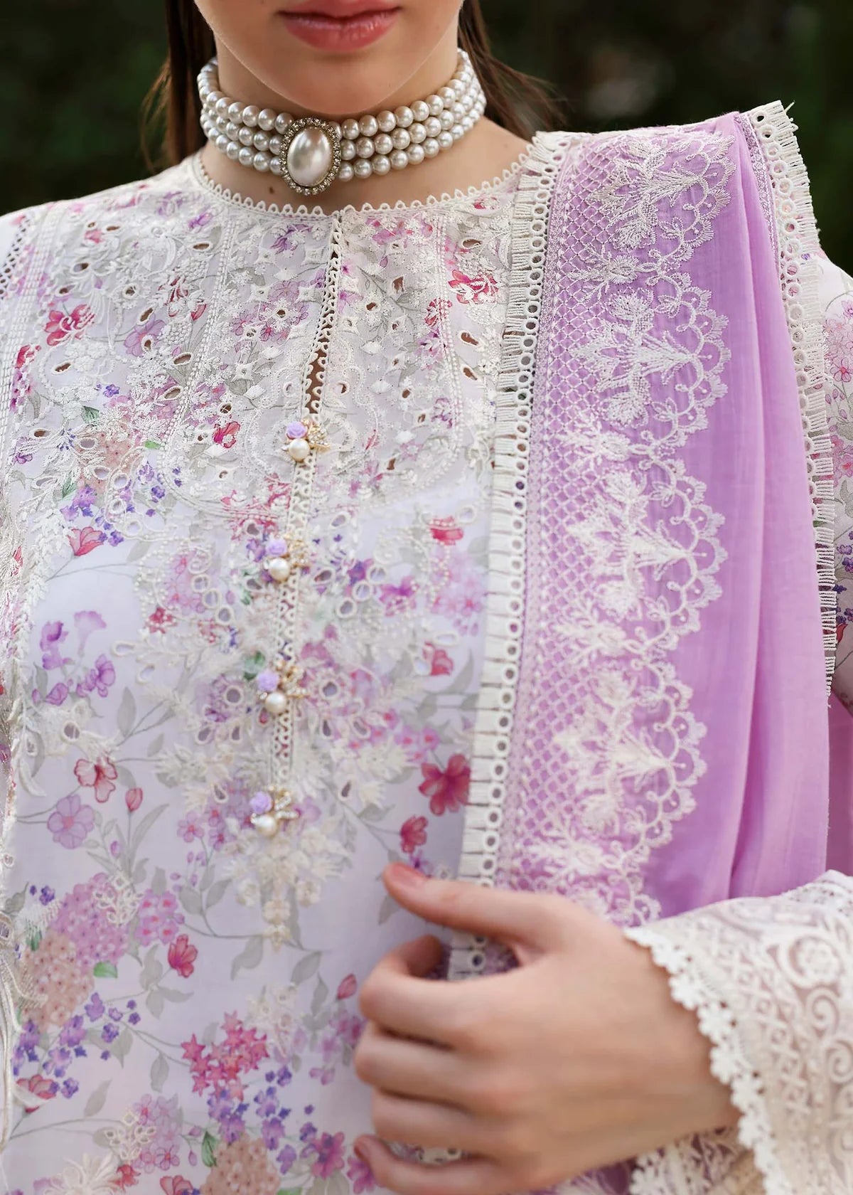 Model wearing pastel pink and white floral Raya dress from Kanwal Malik Zaina Lawn '25, Pakistani luxury pret for online shoppers in UK.