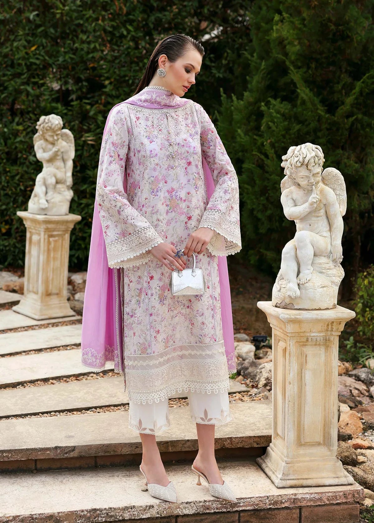 Model wearing pastel pink and white floral Raya dress from Kanwal Malik Zaina Lawn '25, Pakistani luxury pret for online shoppers in UK.