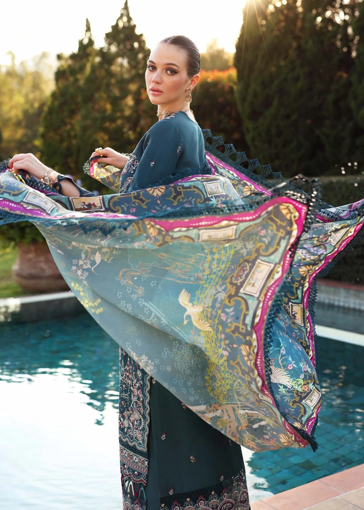 Model wearing deep teal embroidered Livia dress from Kanwal Malik Zaina Lawn '25, Pakistani luxury pret for online shoppers in UK.